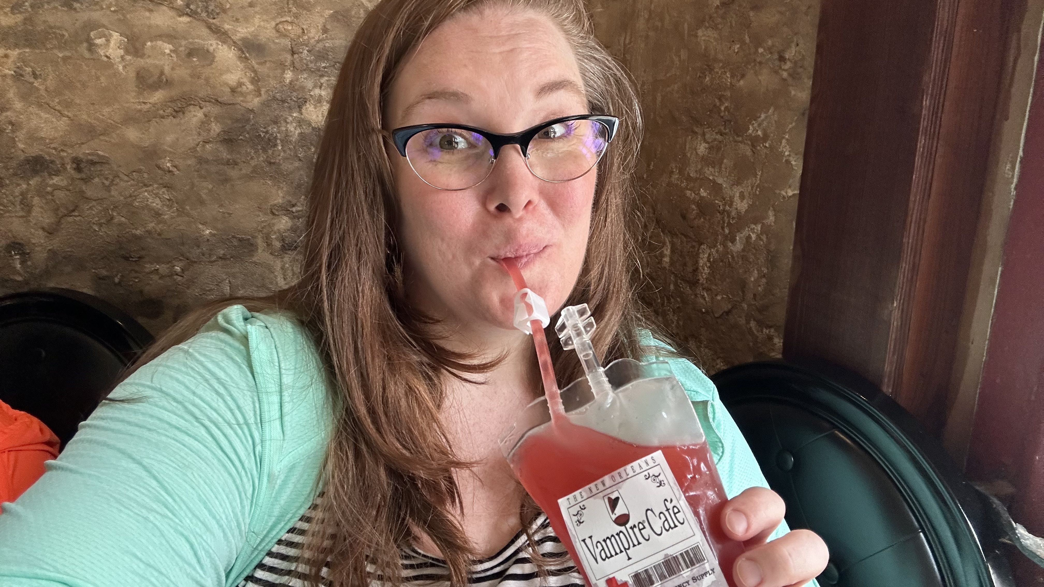 image shows carlie drinking a blood bag cocktail