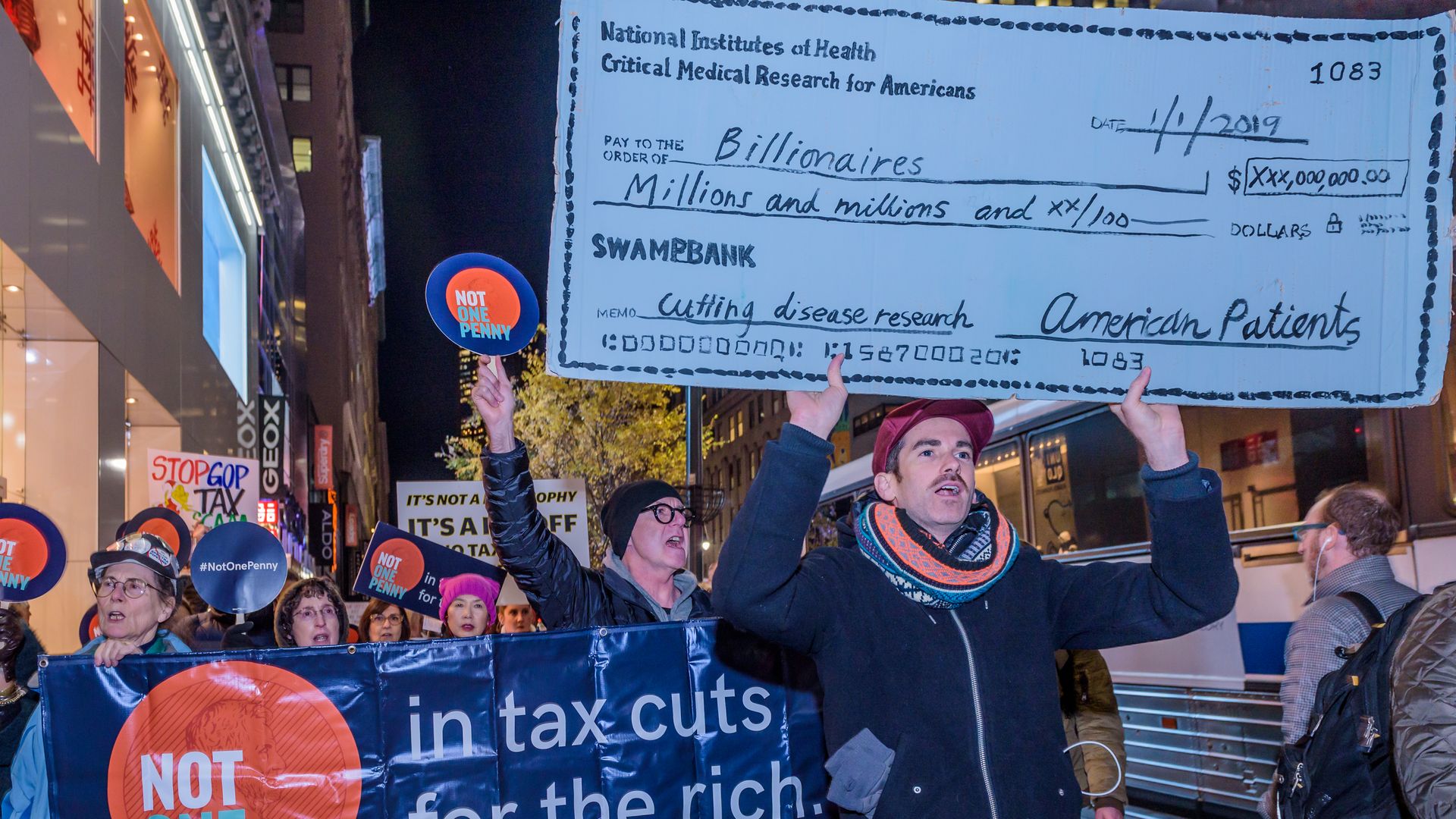 Anti-tax cut protestors march in Manhattan
