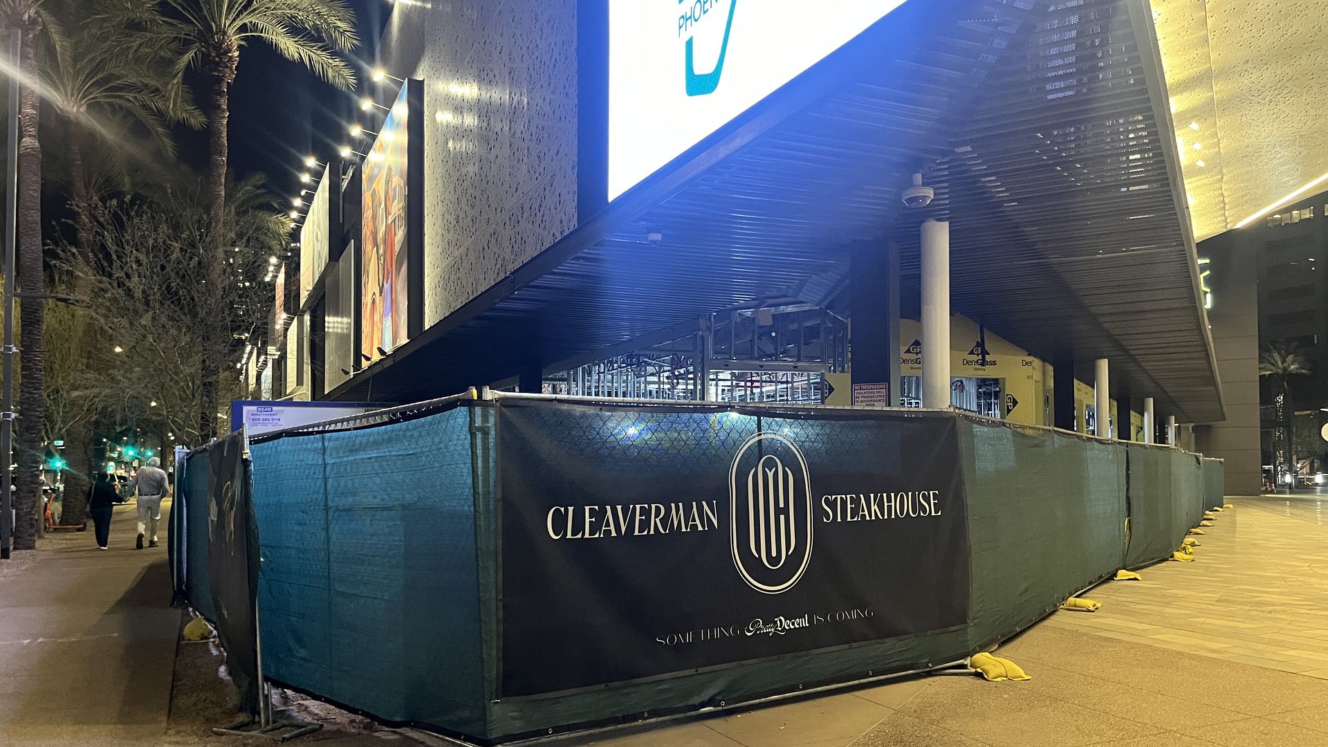 A building with fencing that says, Cleaverman Steakhouse. 