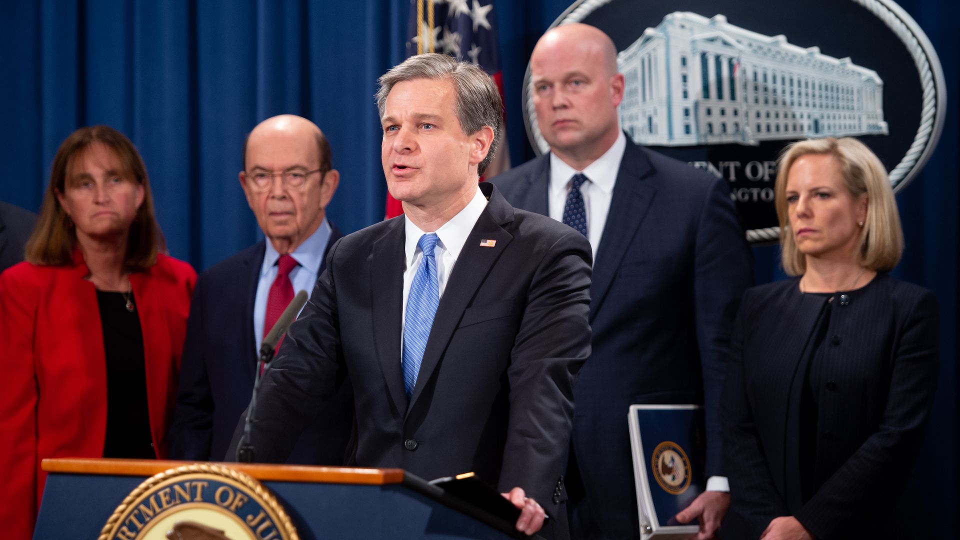 FBI Director Christopher Wray announces a 13-count indictment of financial fraud charges against Chinese telecommunications manufacturer Huawei