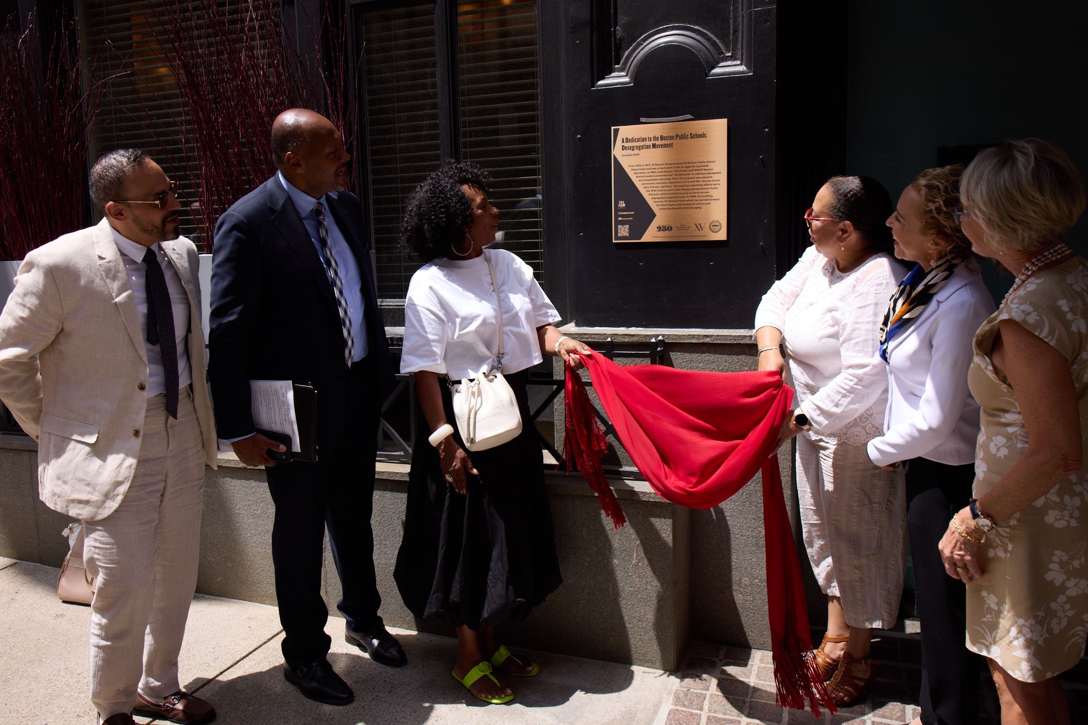 Local officials and leaders unveil a bronze plaque commemorating Boston's school desegregation movement at the former site of the Boston School Department at 15 Beacon St., which today is the upscale steakhouse Moo....Beacon Hill.