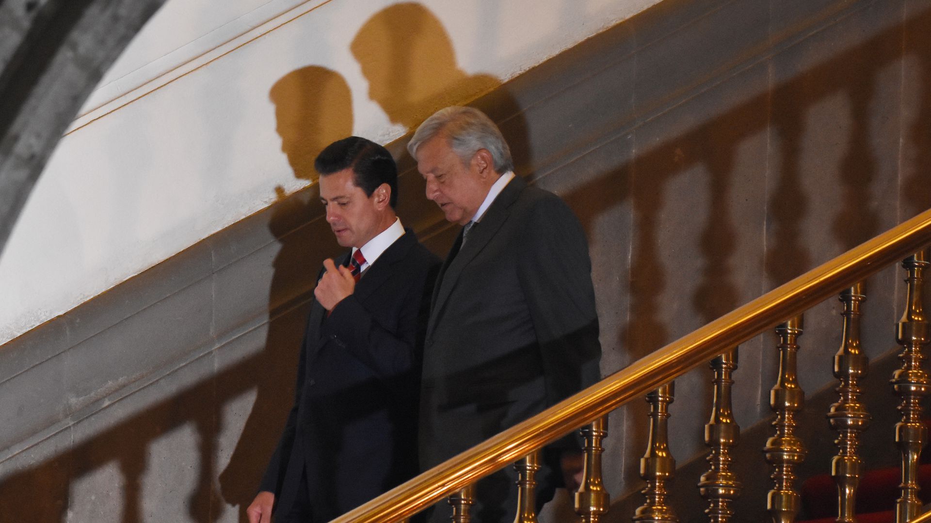 Mexican President Enrique Peña Nieto walks down stairs