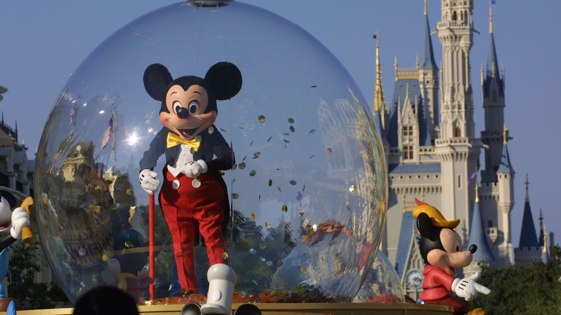 Mickey Mouse rides in a parade at Disney World's Magic Kingdom in Orlando, Florida.