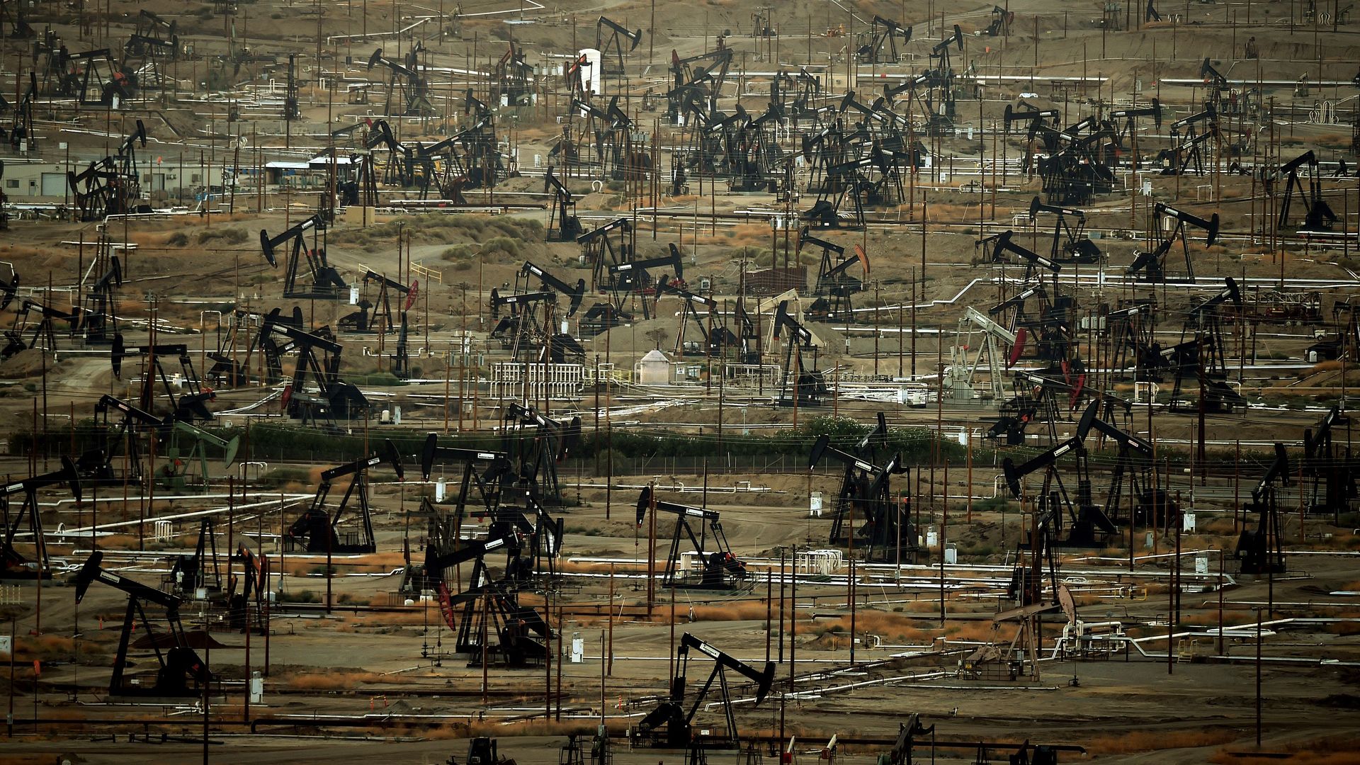 A general view shows oil pumping jacks and drilling pads at the Kern River Oil Field 