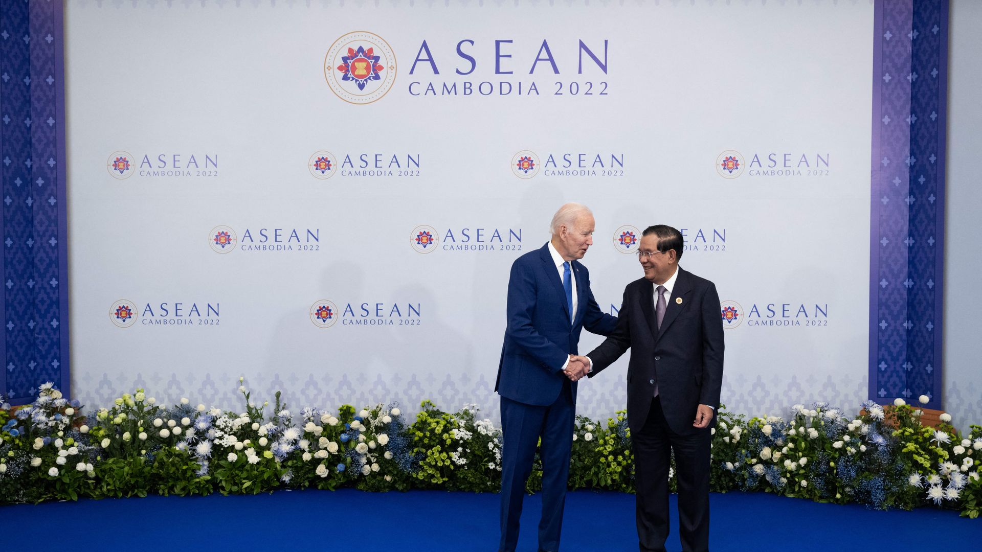 Biden shakes hands with Cambodia's Prime Minister Hun Sen as they meet on the sidelines of the Association of Southeast Asian Nations (ASEAN) Summit in Phnom Penh on November 12, 2022