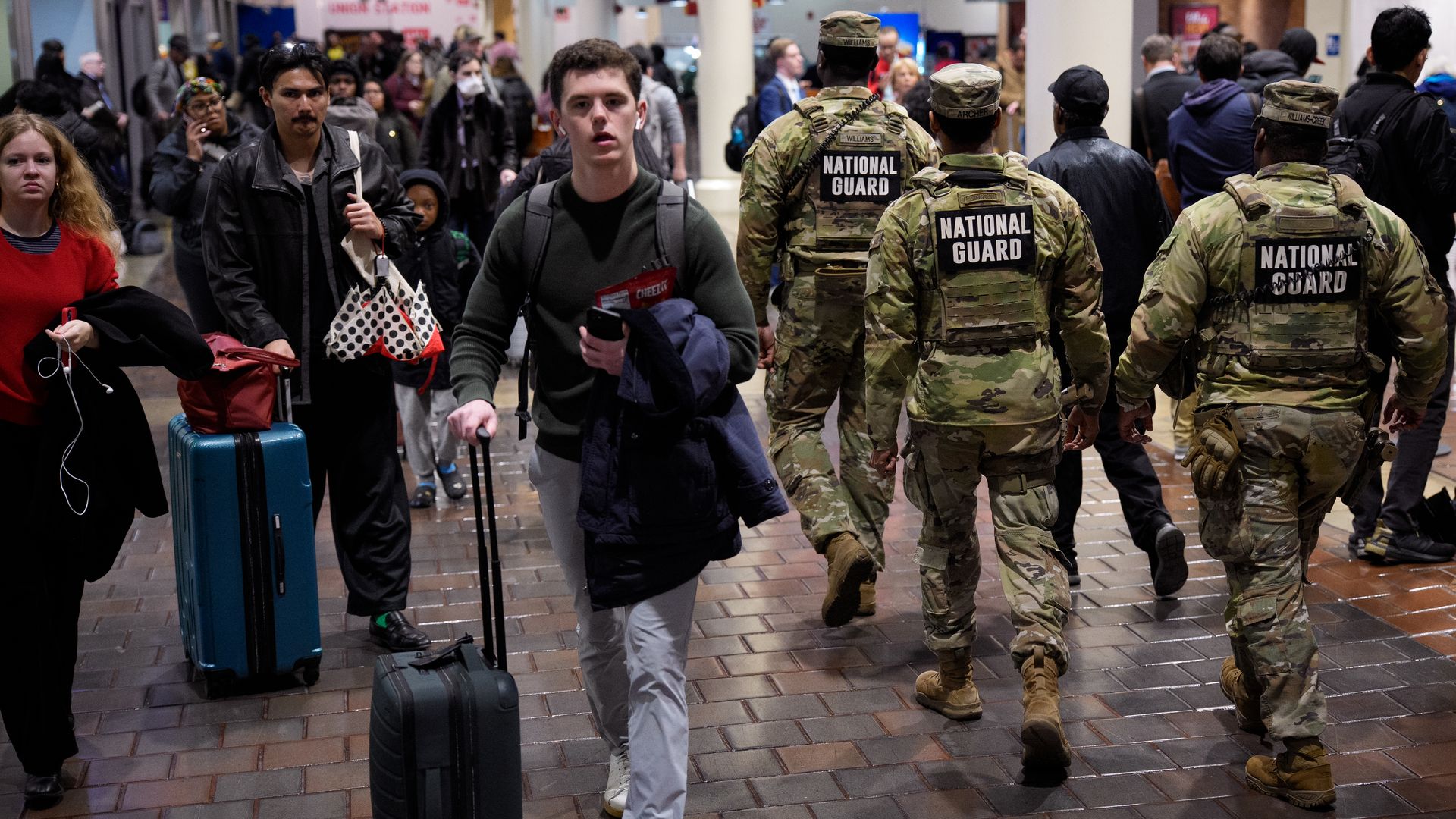 Members of the National Guard move through Union Station with travelers on Nov. 25 in Washington, D.C. 