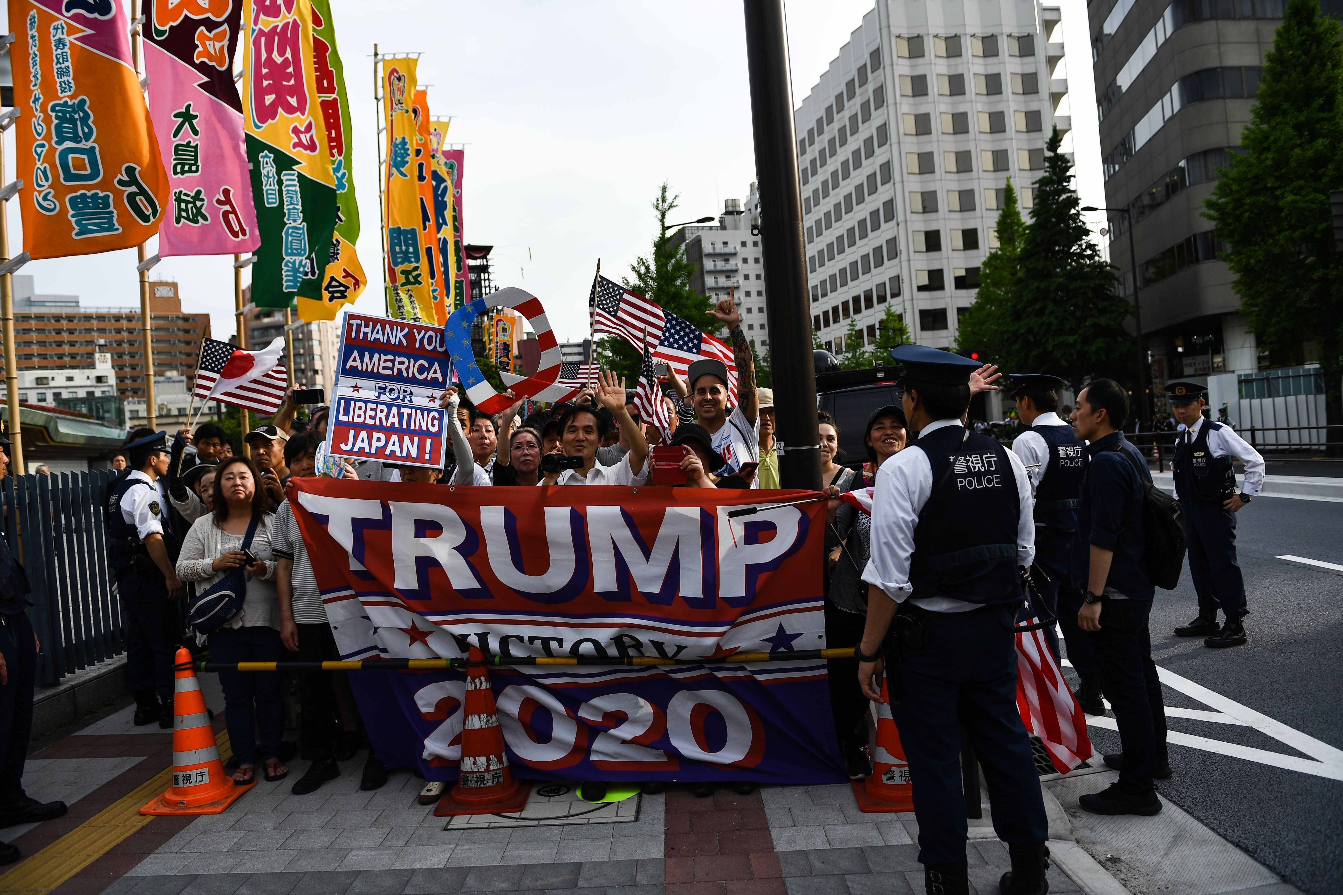 Supporters near Ryogoku Kokugikan Stadium before the arrival of the Trumps for the Summer Grand Sumo Tournament. 