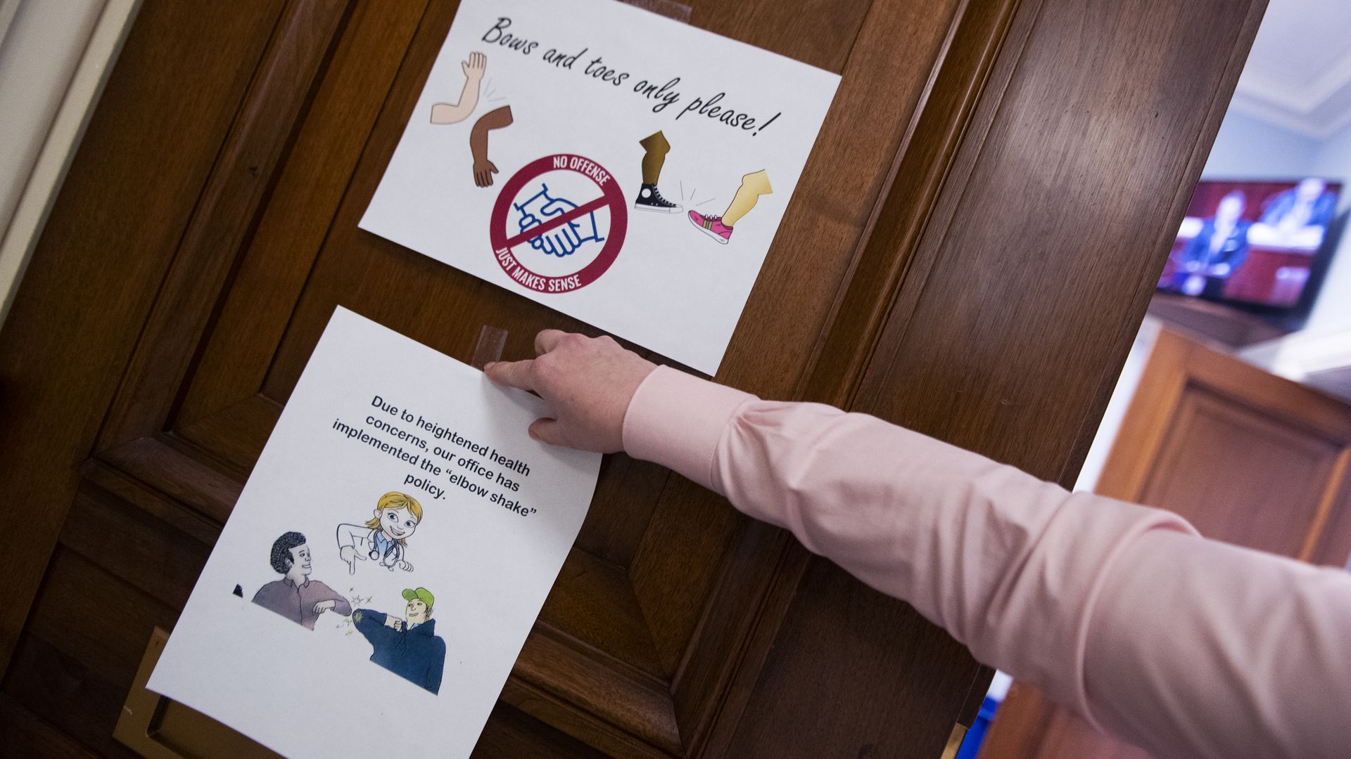 Congressional aide tapes up coronavirus warning signs