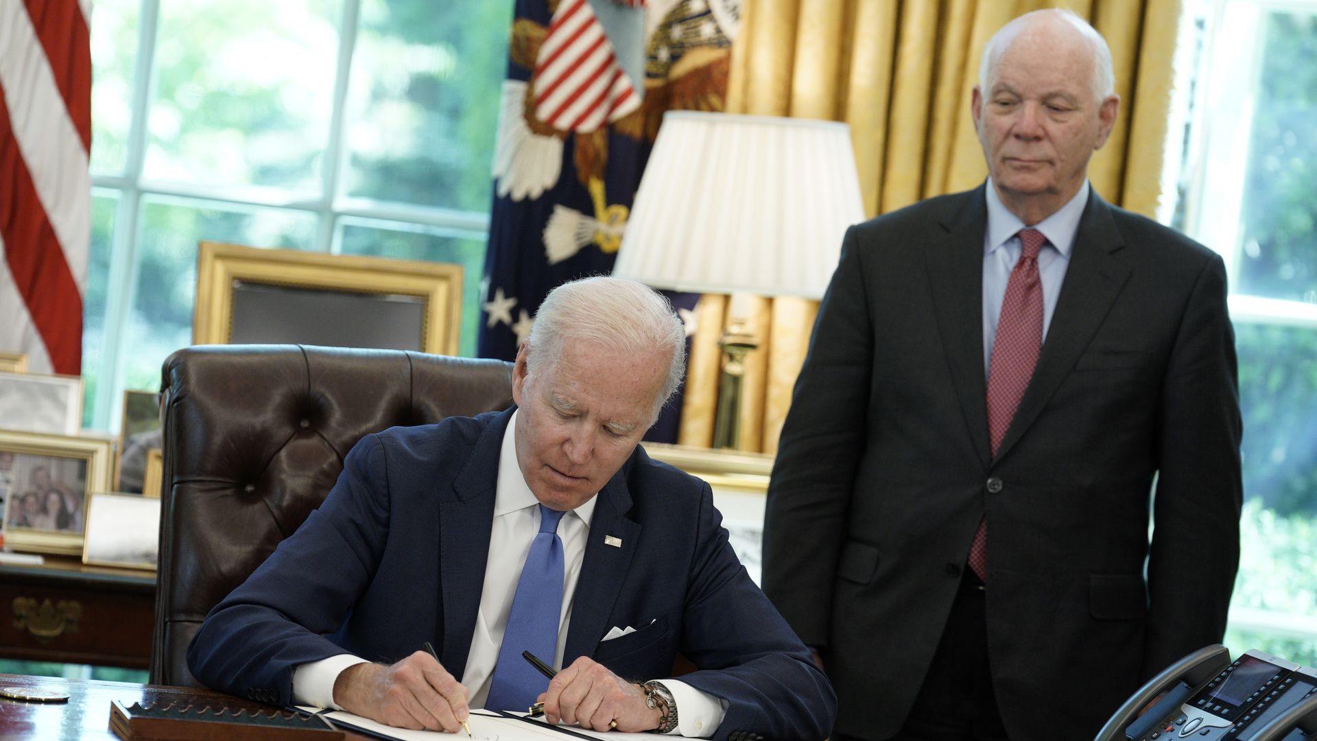 Sen. Ben Cardin of Maryland is seen looking on as President Biden signs the Ukraine Lend-Lease Act.