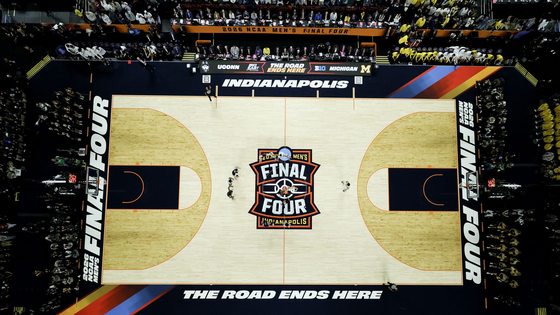 An aerial view of a basketball court that says "FINAL FOUR" in the middle and "the road ends here" at the bottom