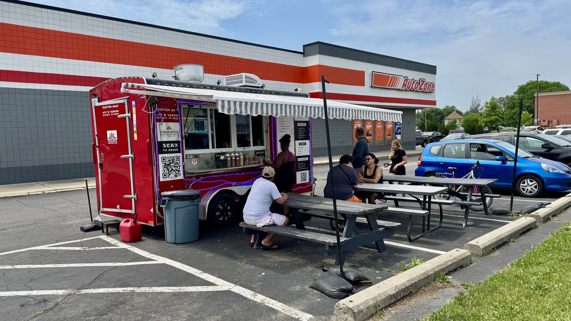The taco truck shown in front of the auto zone.