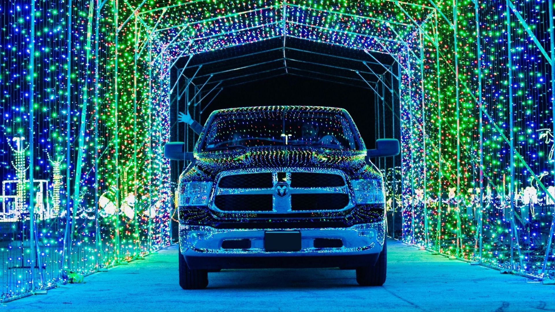 Car in a Christmas light tunnel