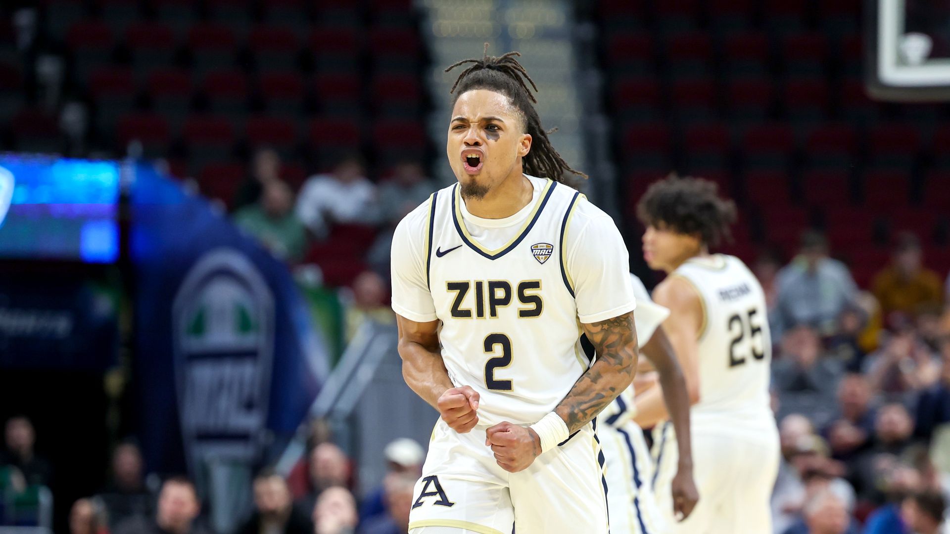 Akron Zips player No. 2 celebrates after a play on the court. 