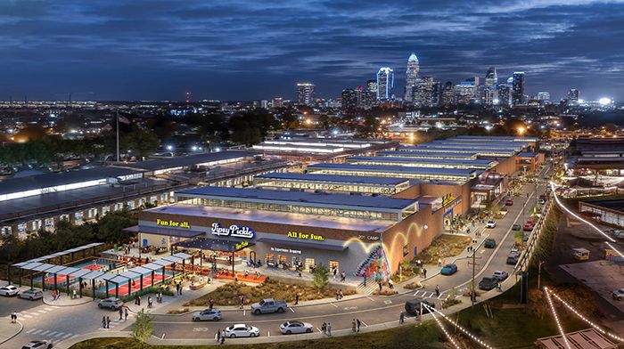 Tipsy Pickle rendering with the Charlotte skyline in the background. 