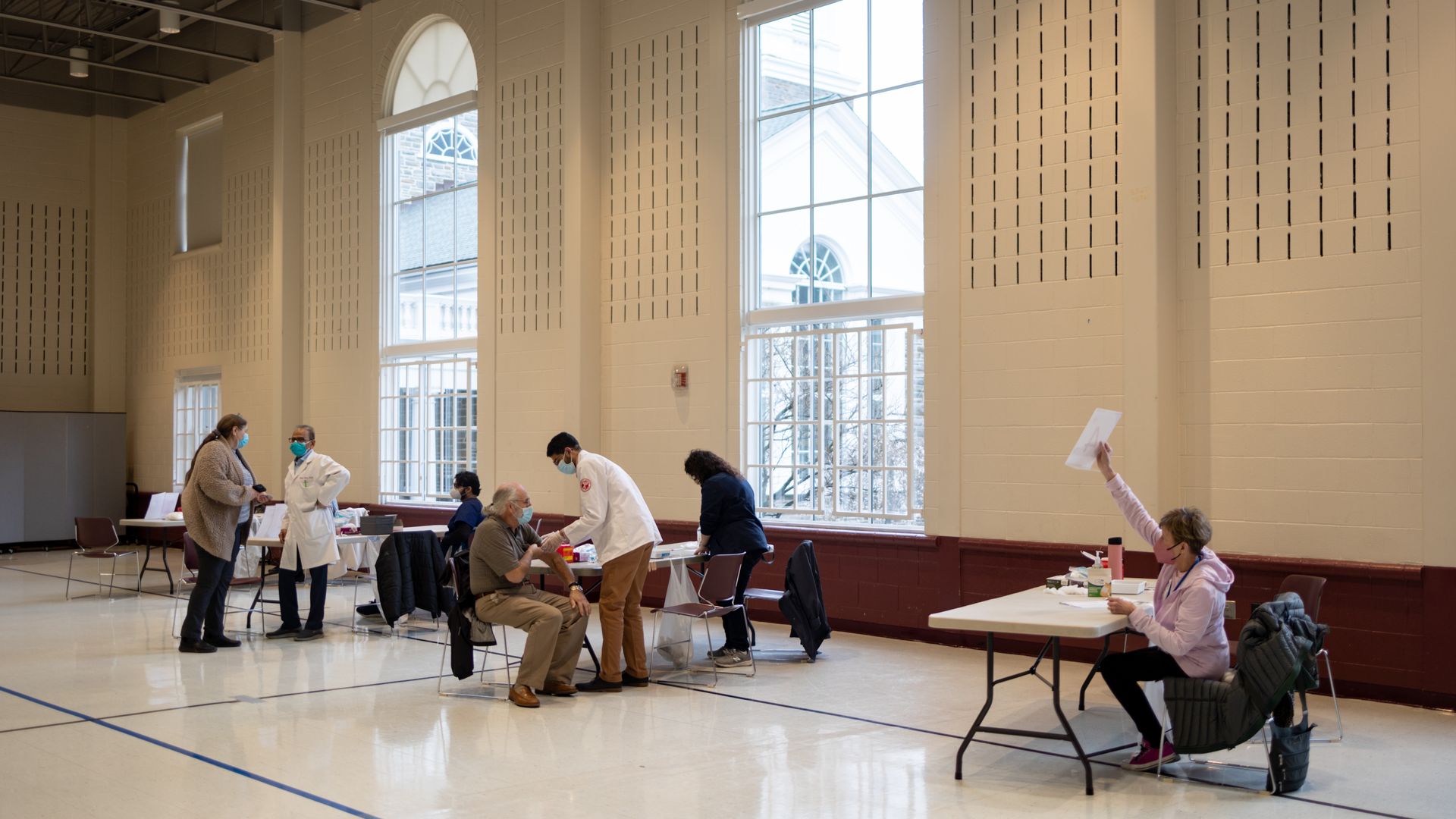 Healthcare workers at a Covid-19 vaccine clinic inside Trinity Evangelic Lutheran Church in Lansdale, Pennsylvania, U.S, on Tuesday, Apr. 5, 2022