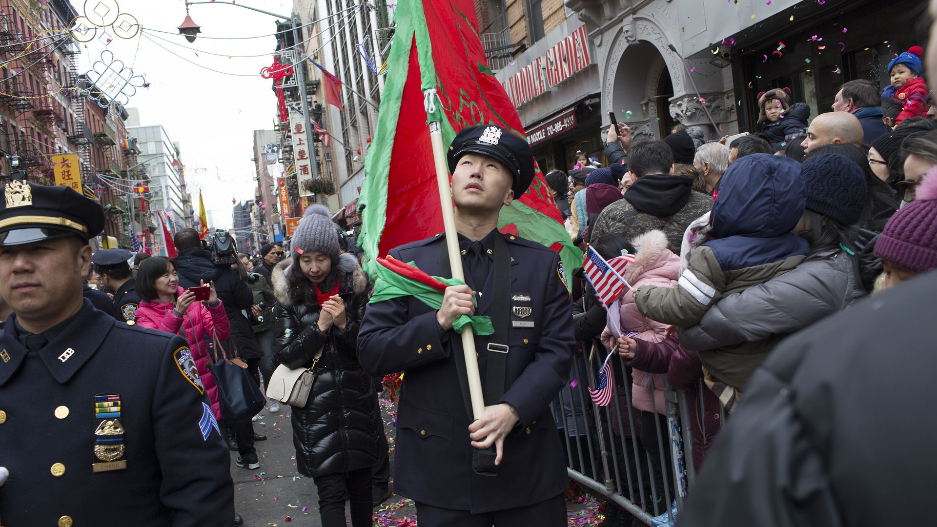 An Asian American police officer walks through New York's Chinese American community during an annual parade on February 17, 2019.