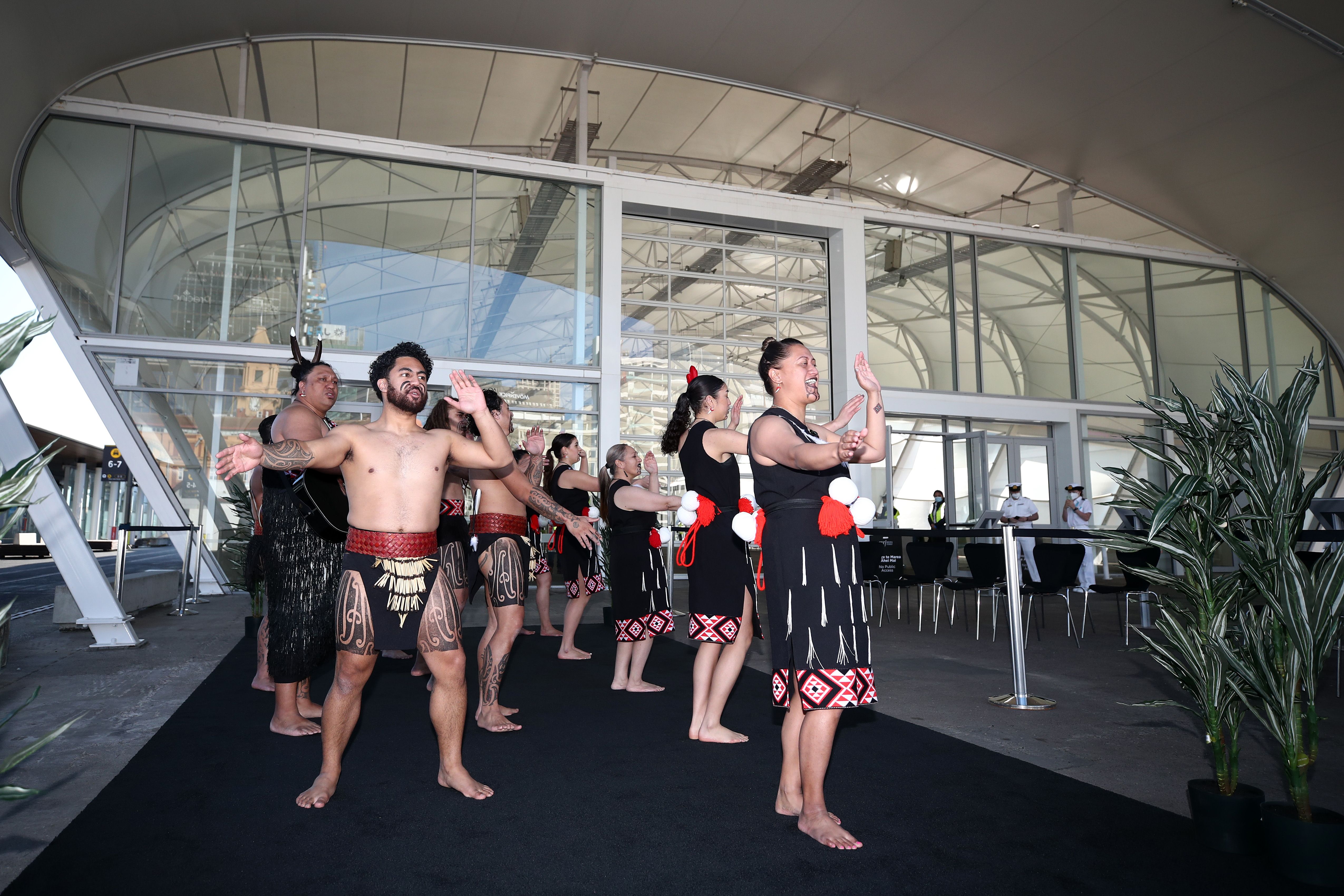A Ngati Whatua group welcomes passengers as the Pacific Explorer arrives in Auckland Harbour on August 12, 2022 in Auckland, New Zealand. 
