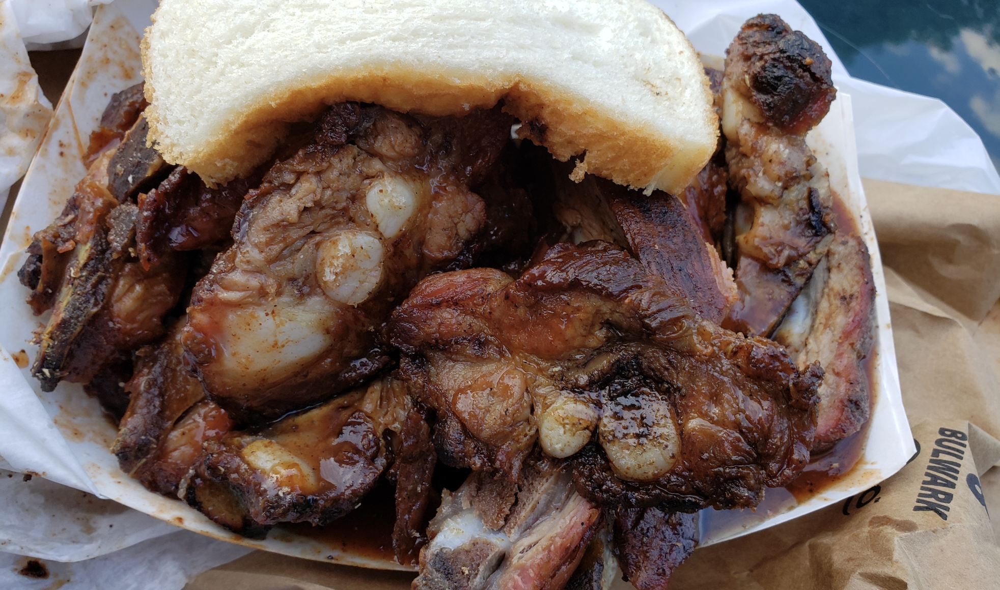 Saucey ribs under a piece of bread