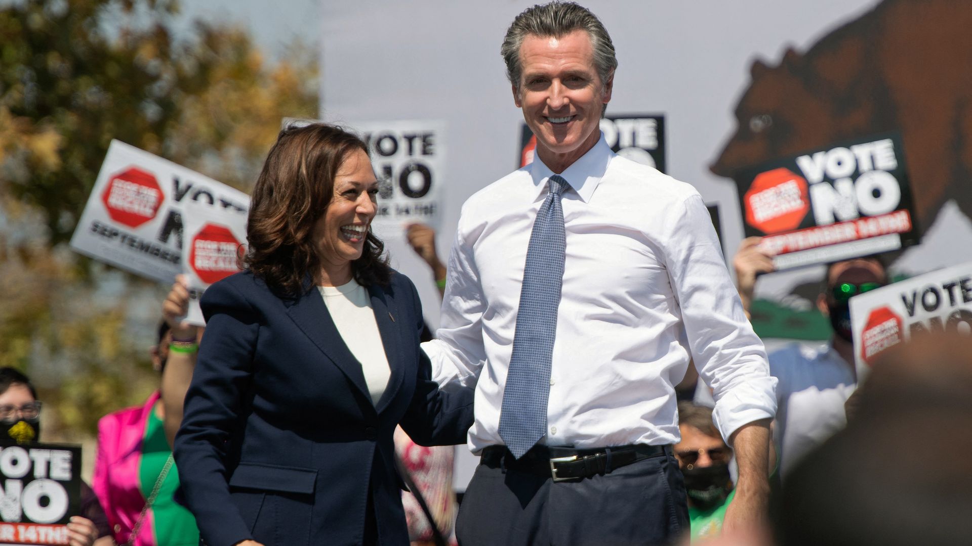Kamala Harris stands with California Governor Gavin Newsom during a campaign event