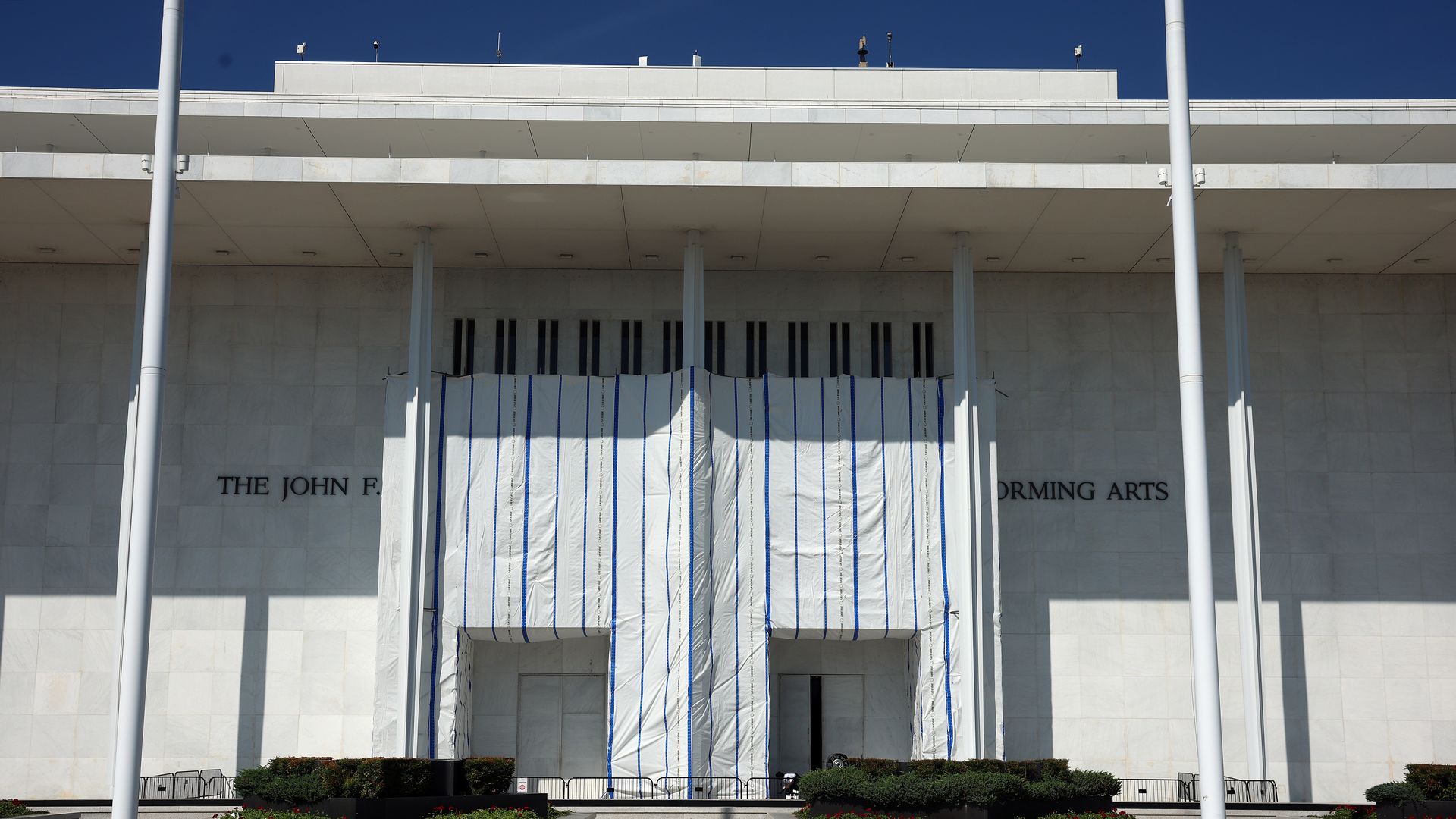 A tarp covers parts of the front of the John F. Kennedy Center for the Performing Arts.