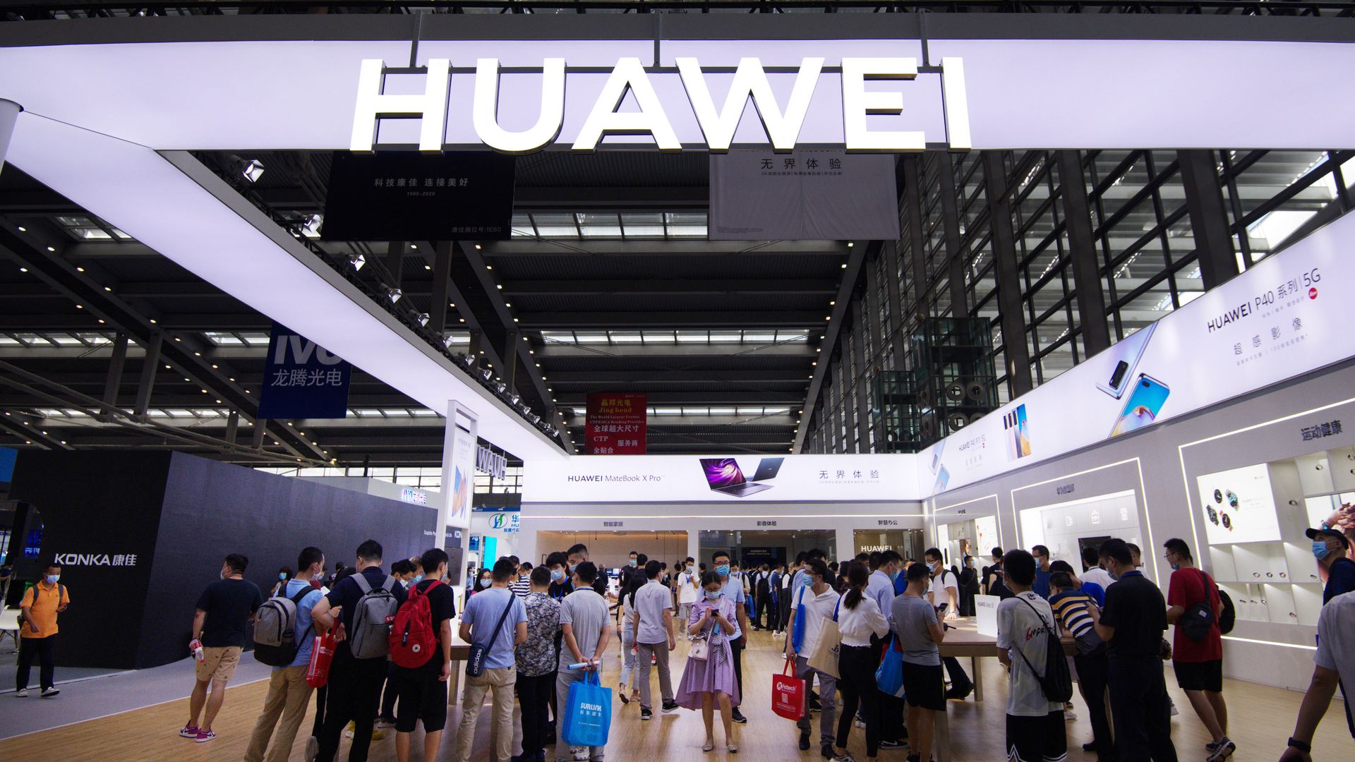 People visit a Huawei booth at a tech expo in China.