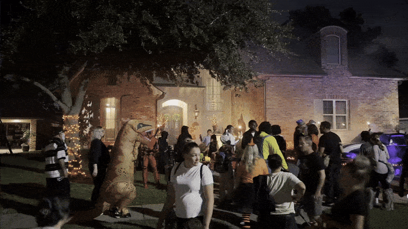 Image shows people in costume trick or treating in Imperial Woods.