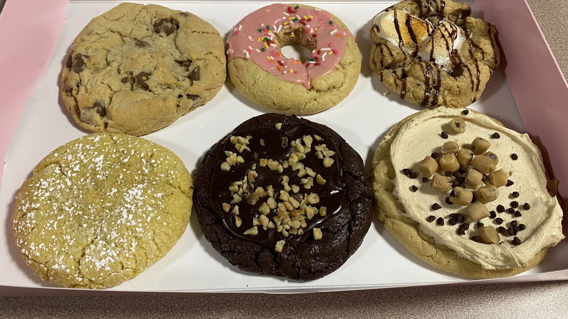 A half-dozen cookies in a box. 