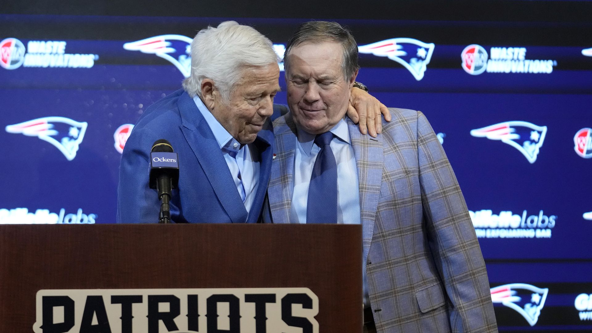 New England Patriots team owner Robert Kraft and now-former head coach Bill Belichick embrace during a press conference on Thursday.