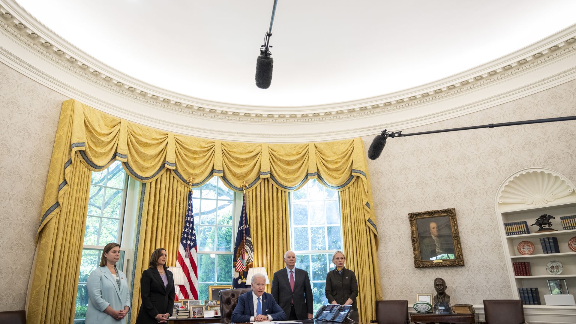 President Biden is seen speaking with reporters during a ceremony to sign the Ukraine Lend-Lease Act.