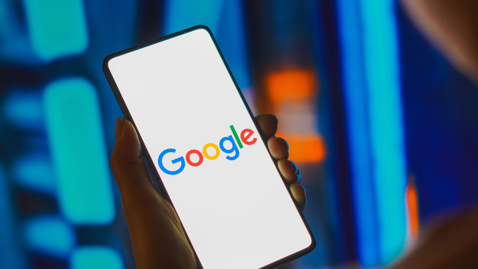 Google label on a lit up smartphone