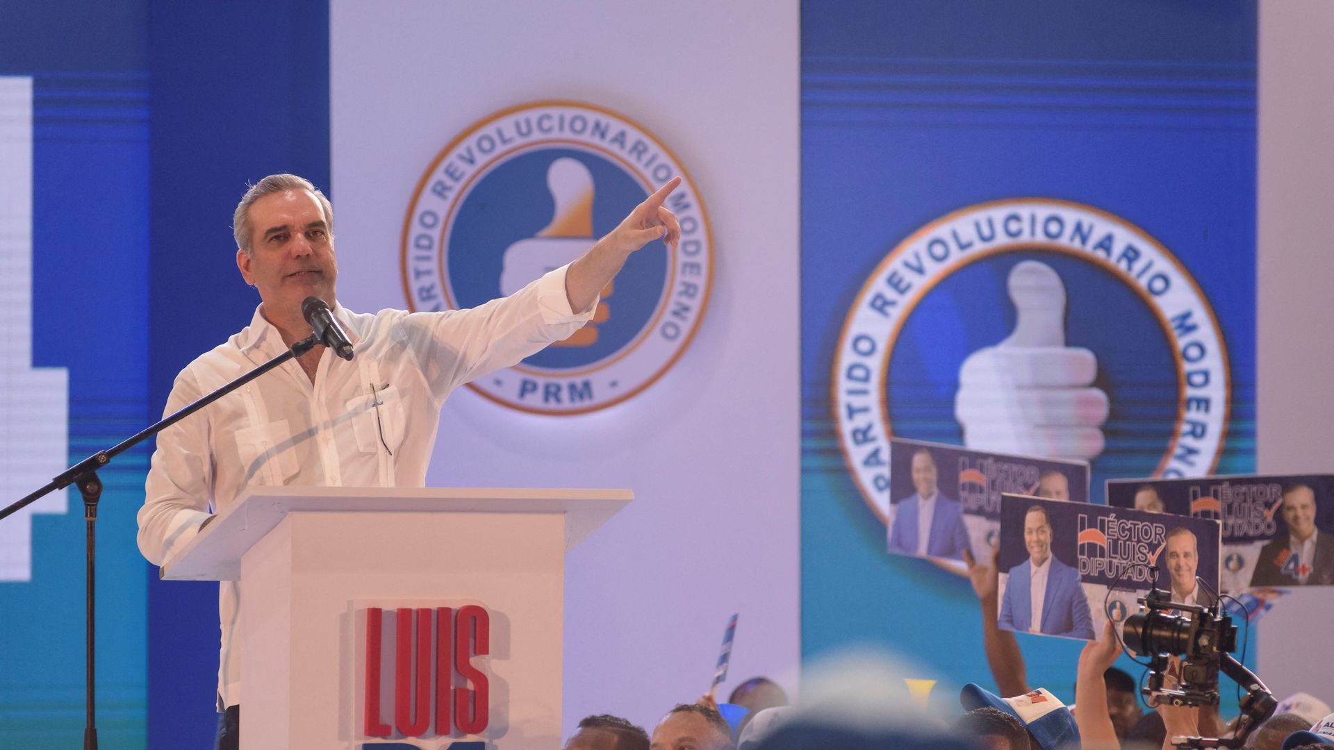 Dominican President Luis Abinader delivers a speech while standing behind a white podium in Santo Domingo, on September 2, 2023. 