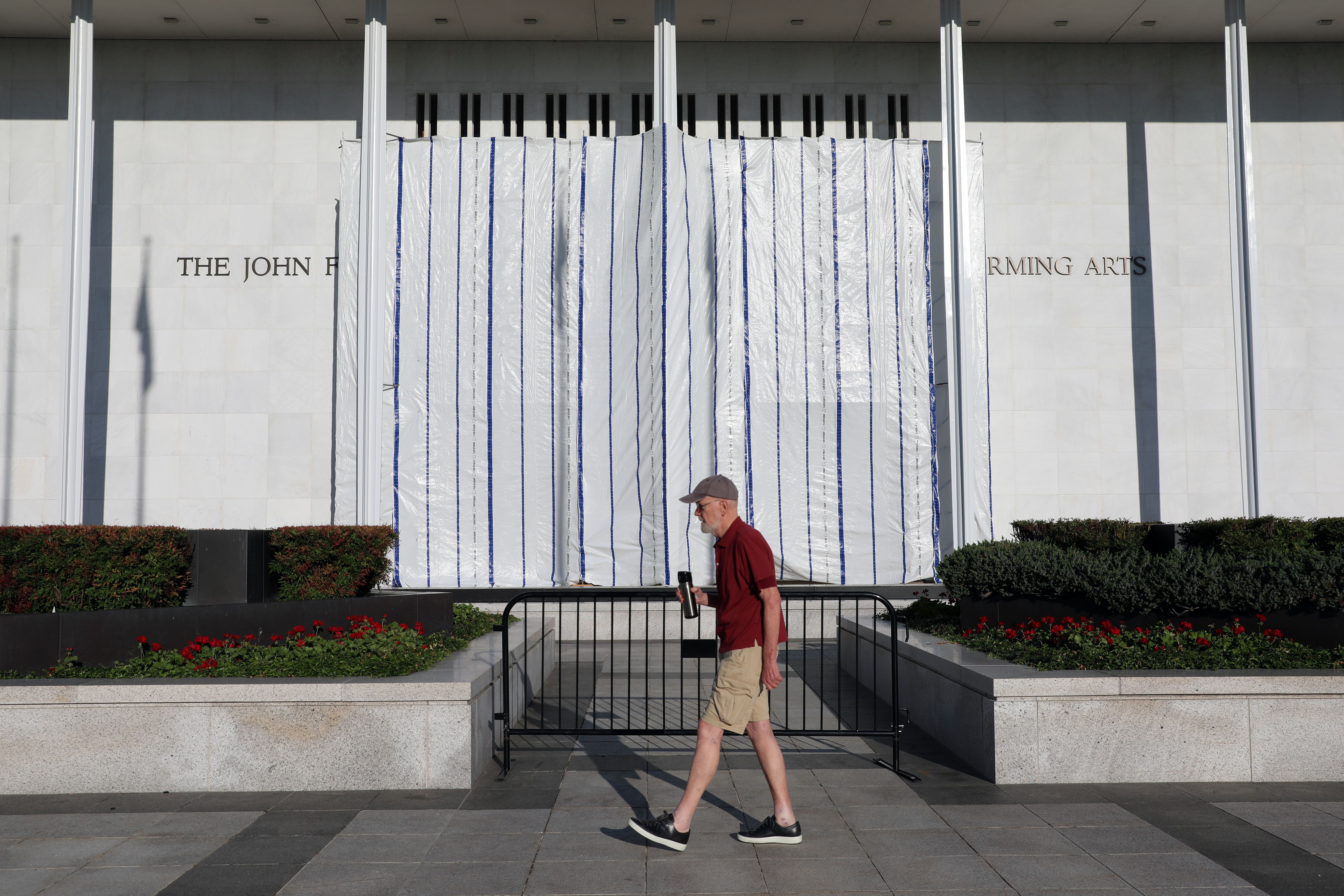 A man walks by the Kennedy Center