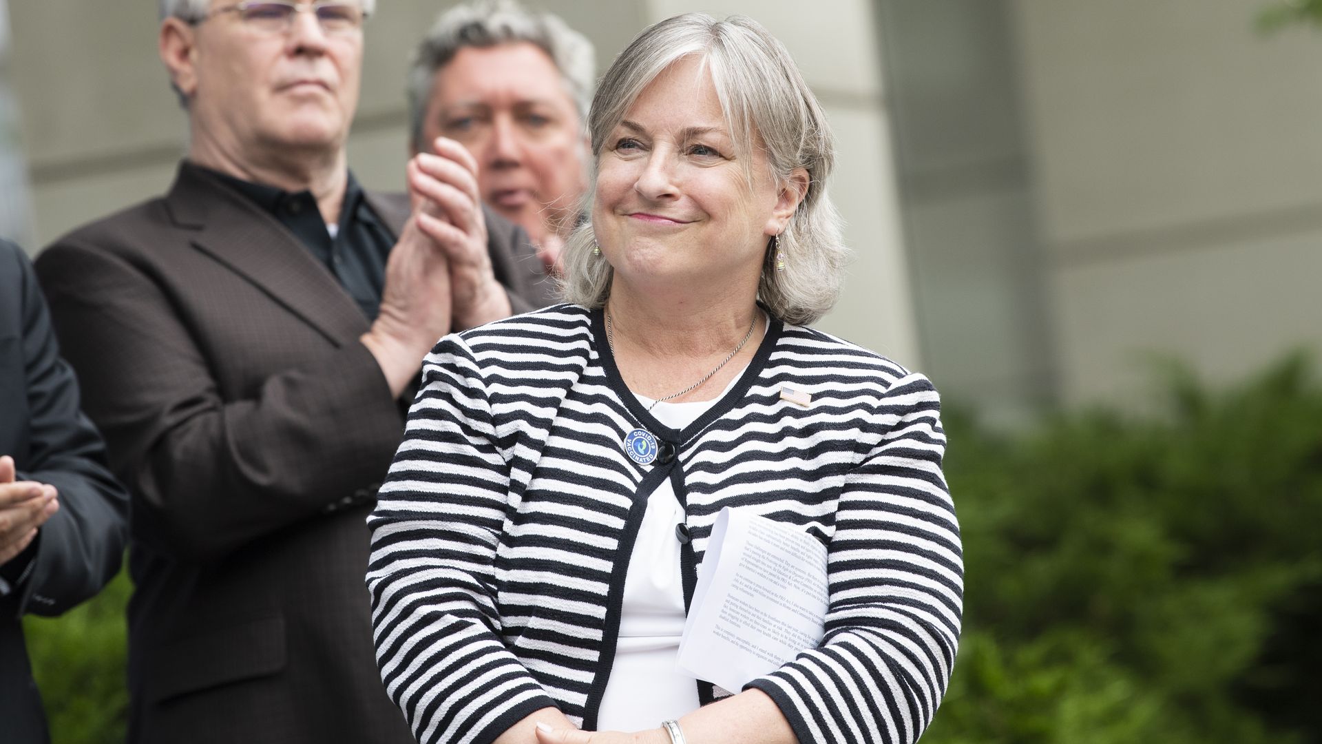 Rep. Susan Wild is seen smiling at a political event.