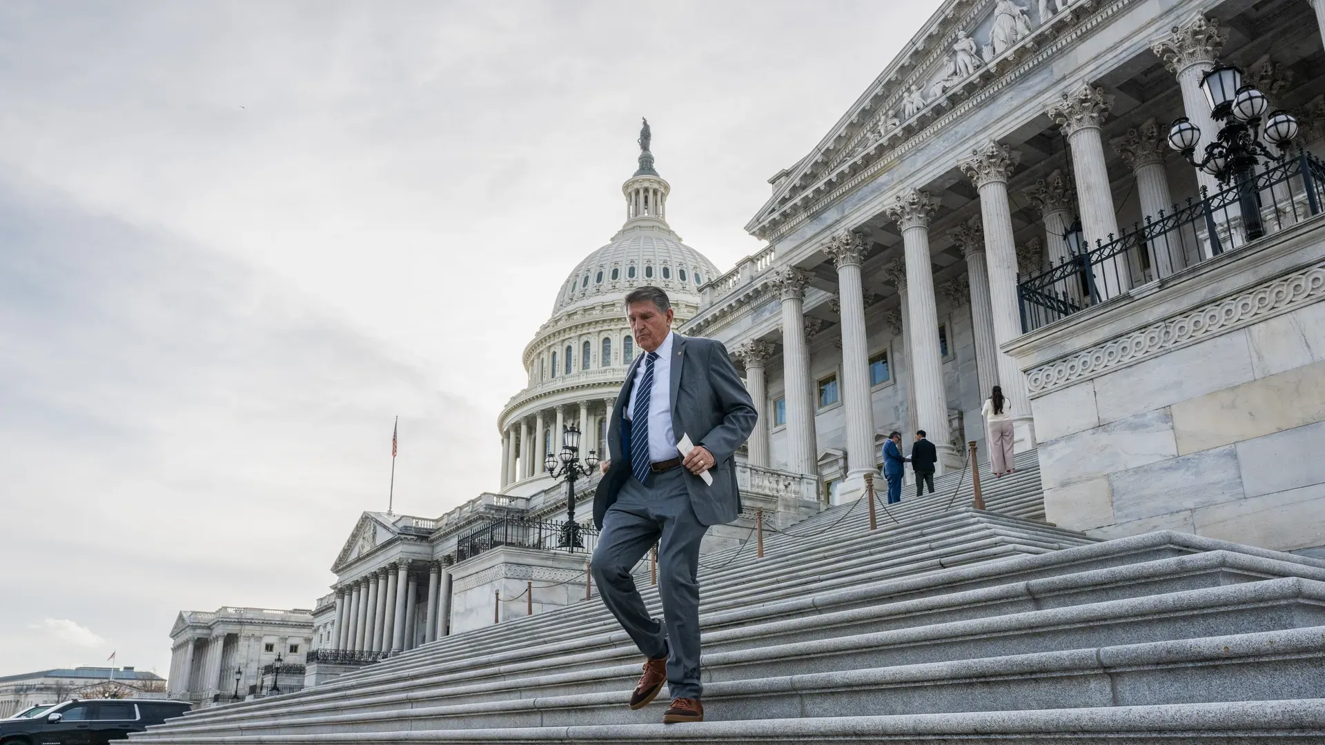 Sen. Joe Manchin walking away from the Capitol building