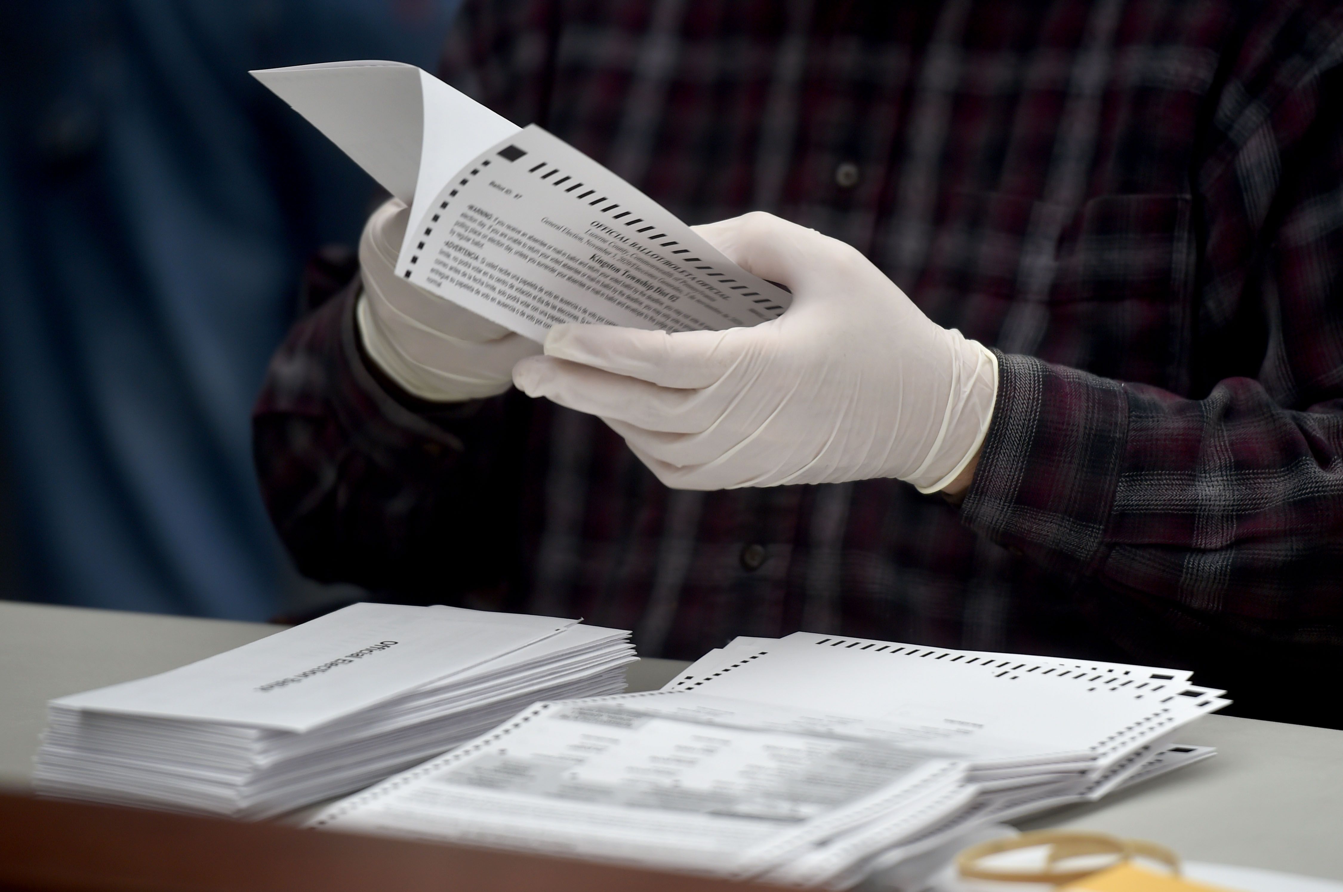 An election worker opens a mail-in ballot in Pennsylvania on Tuesday. Photo: Aimee Dilger/SOPA Images/LightRocket via Getty Images
