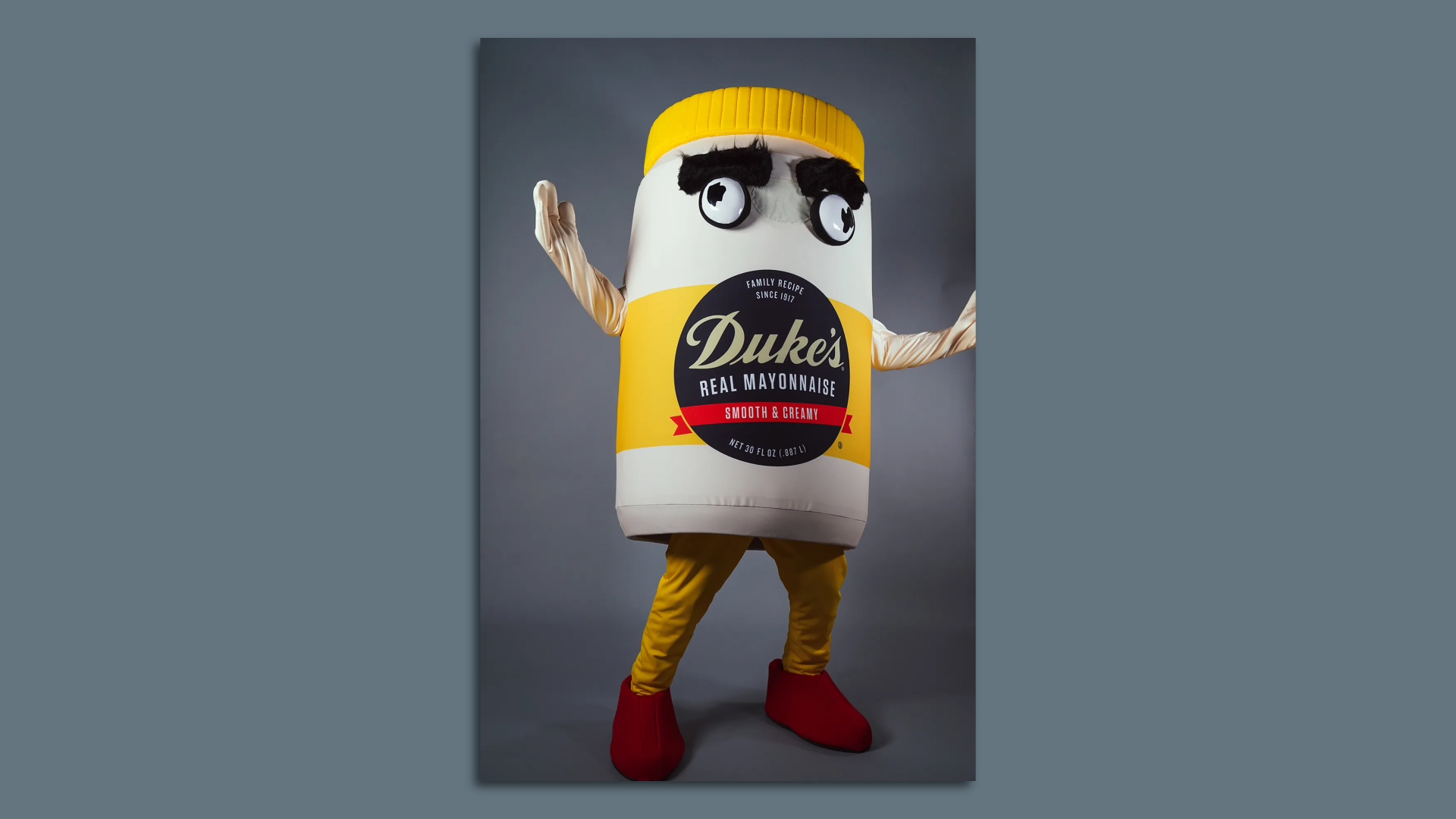 A man wearing a jar of Duke's Mayo costume 