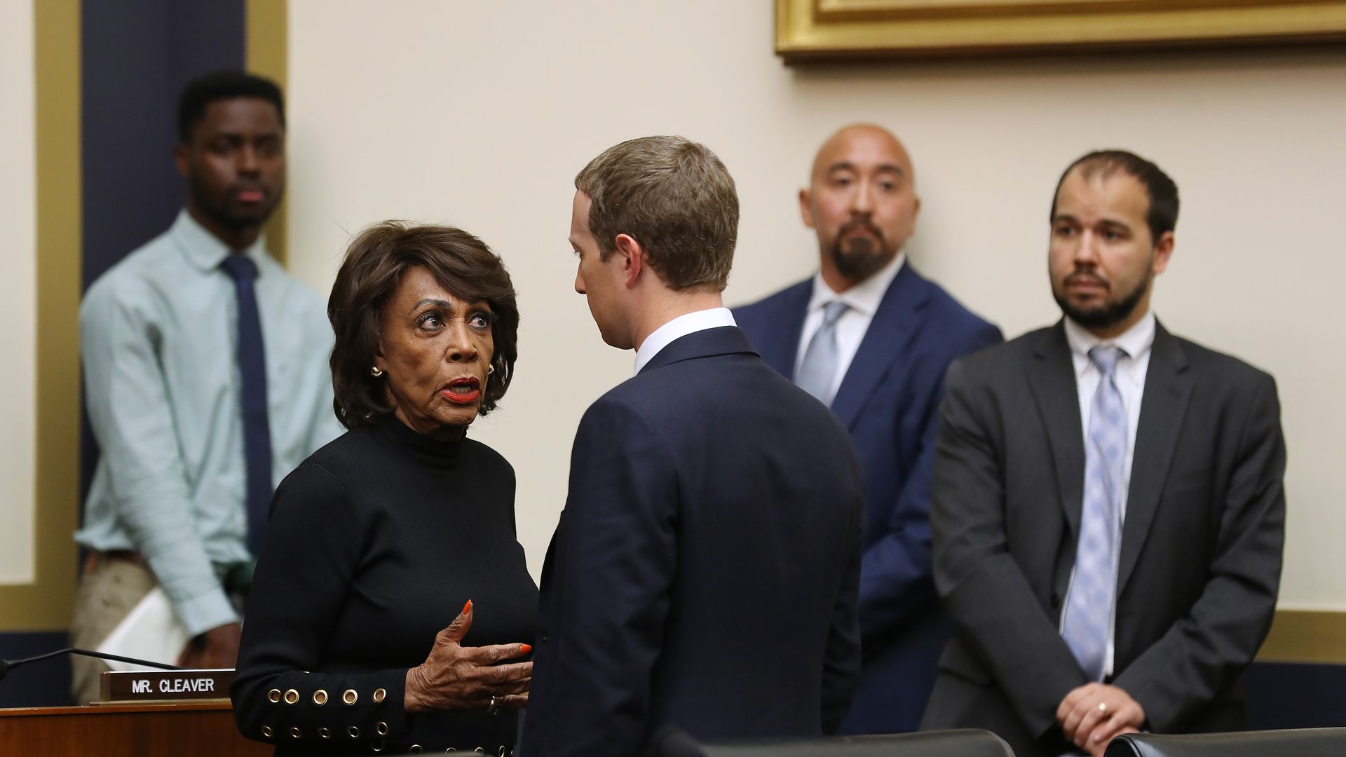 House Financial Services Committee Chair Maxine Waters (D-CA) talks with Facebook co-founder and CEO Mark Zuckerberg after he testified to the committee, October 23,2019.