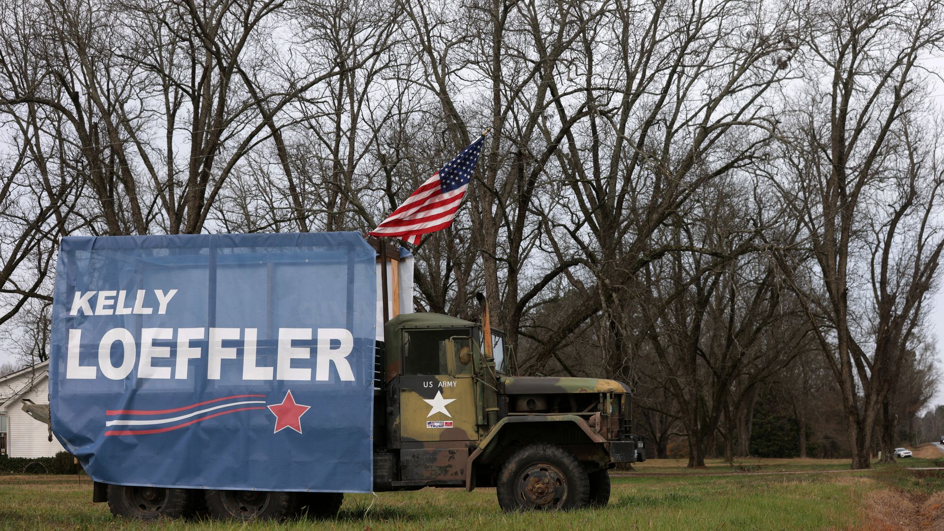 A vehicle in Macon, Ga., is seen carrying a banner for Republican Senate candidate Kelly Loeffler.