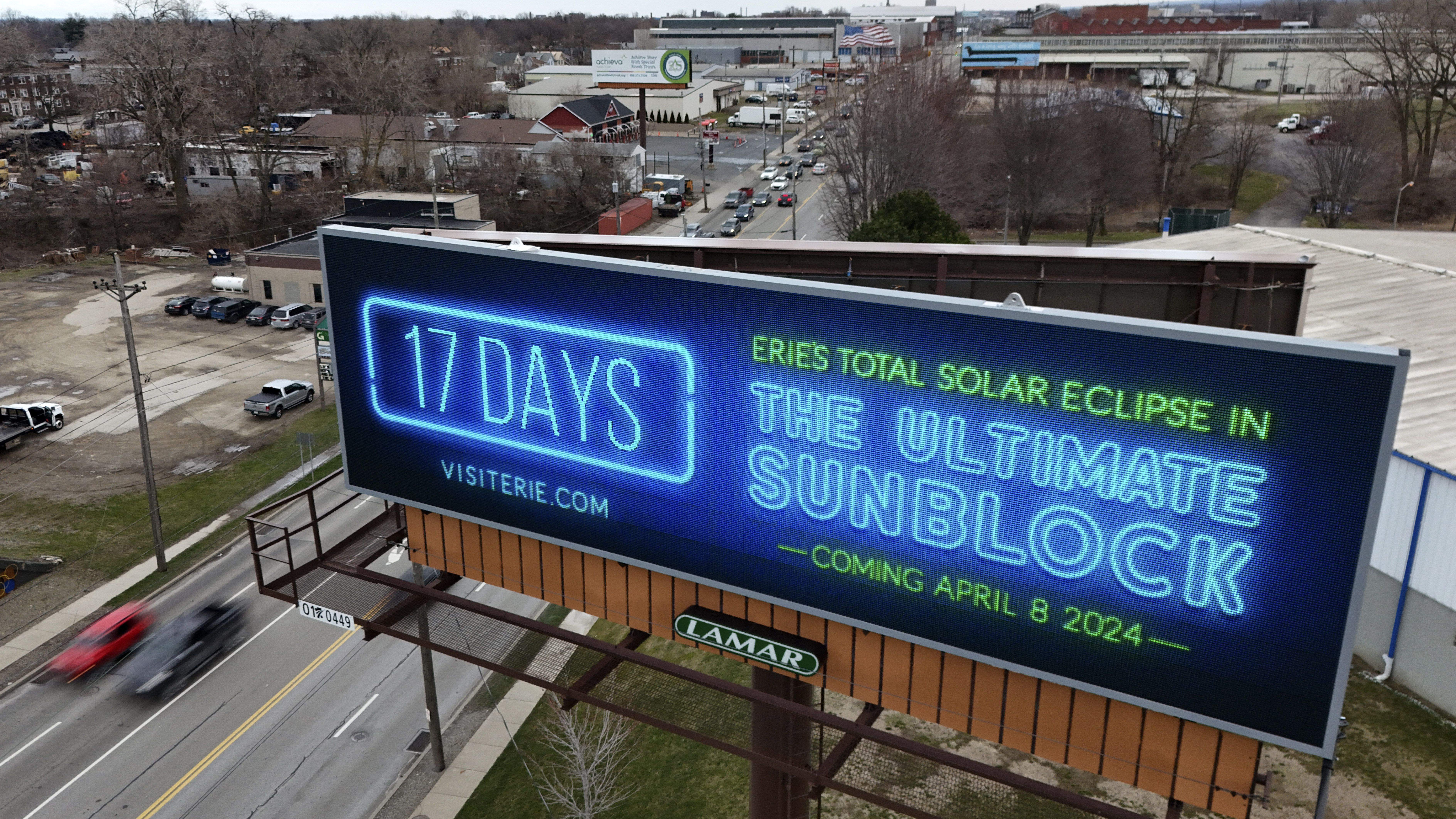 A billboard heralding the upcoming total solar eclipse that Erie will experience is shown in Erie, Pa., on Friday, March 22, 2024. (AP Photo/Gene J. Puskar)