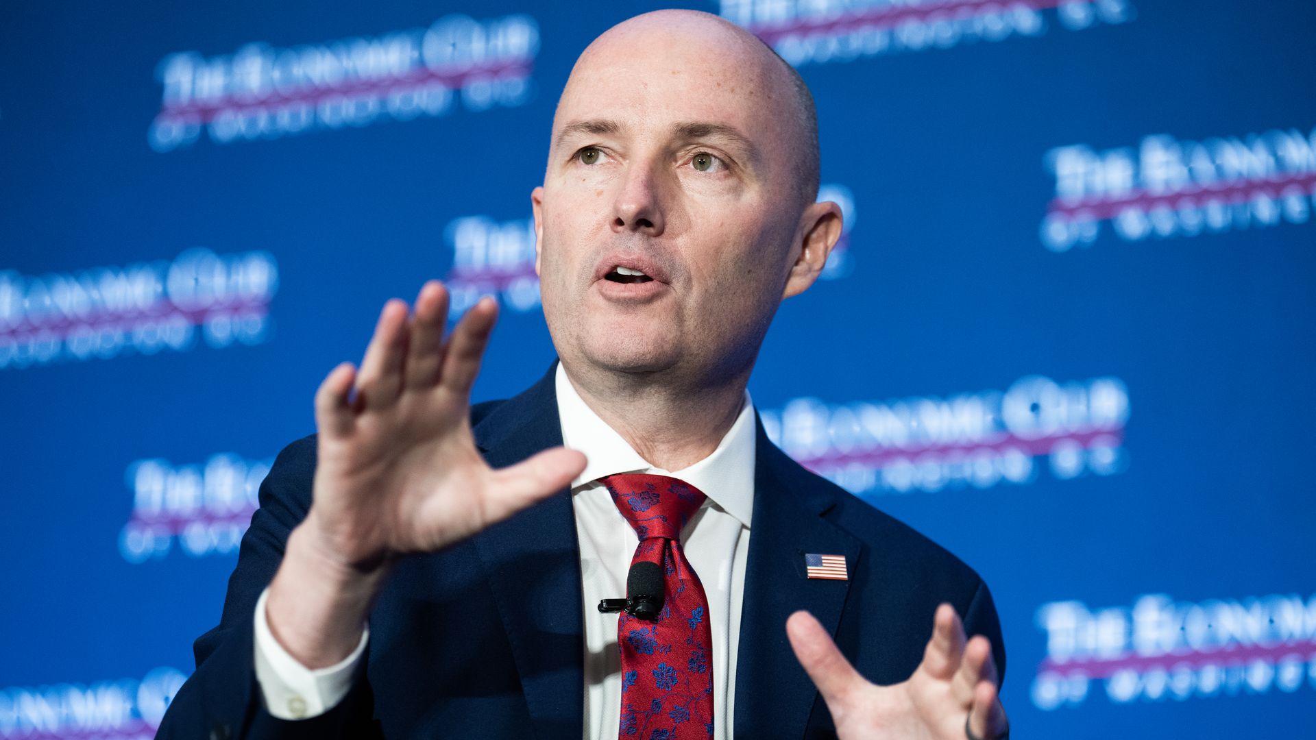 Gov. Cox speaking at a panel. 