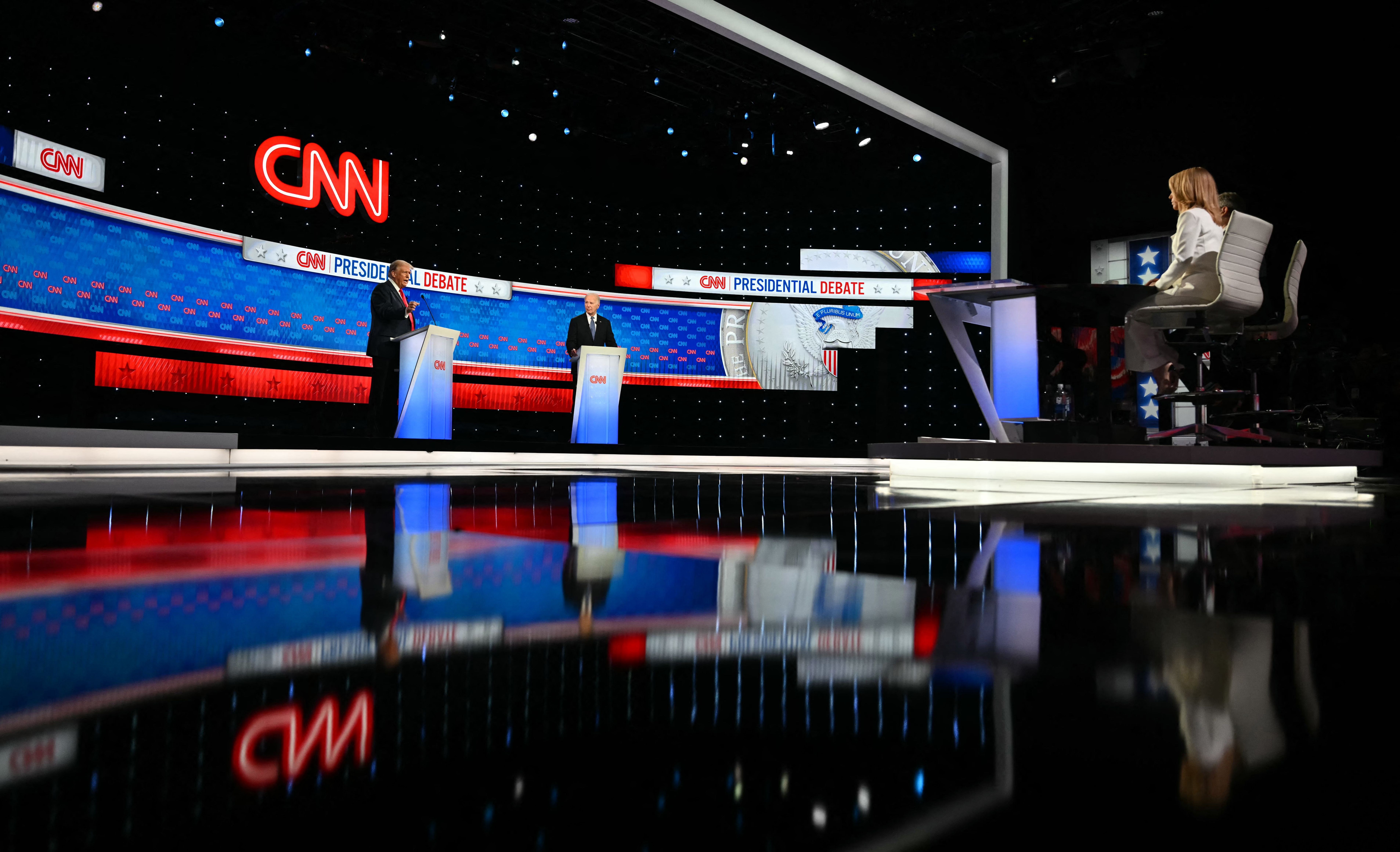  CNN journalists Jake Tapper and Dana Bash (R) moderate the first presidential debate of the 2024 elections between US President Joe Biden and former US President and Republican presidential candidate Donald Trump at the CNN's studios in Atlanta, Georgia, on June 27, 2024. 