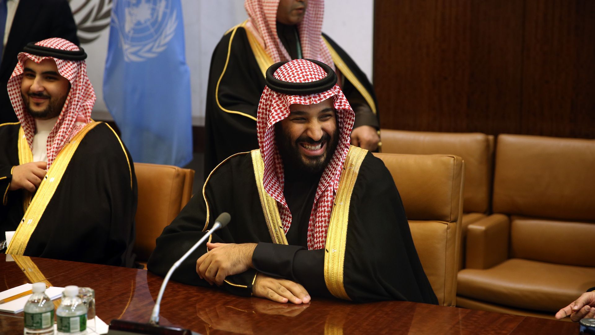 Saudi Crown Prince Mohammed bin Salman sitting at a table