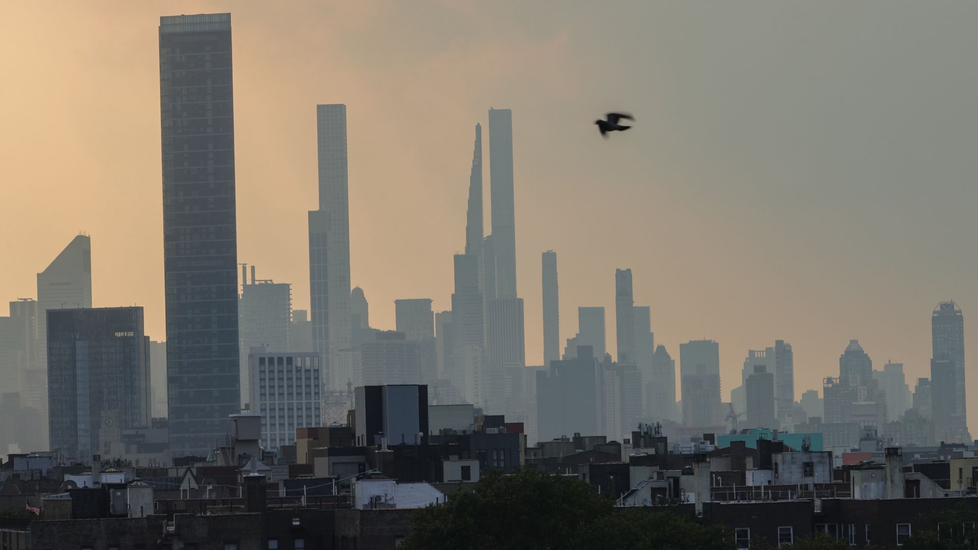 The New York City skyline against a haze of wildfire smoke.