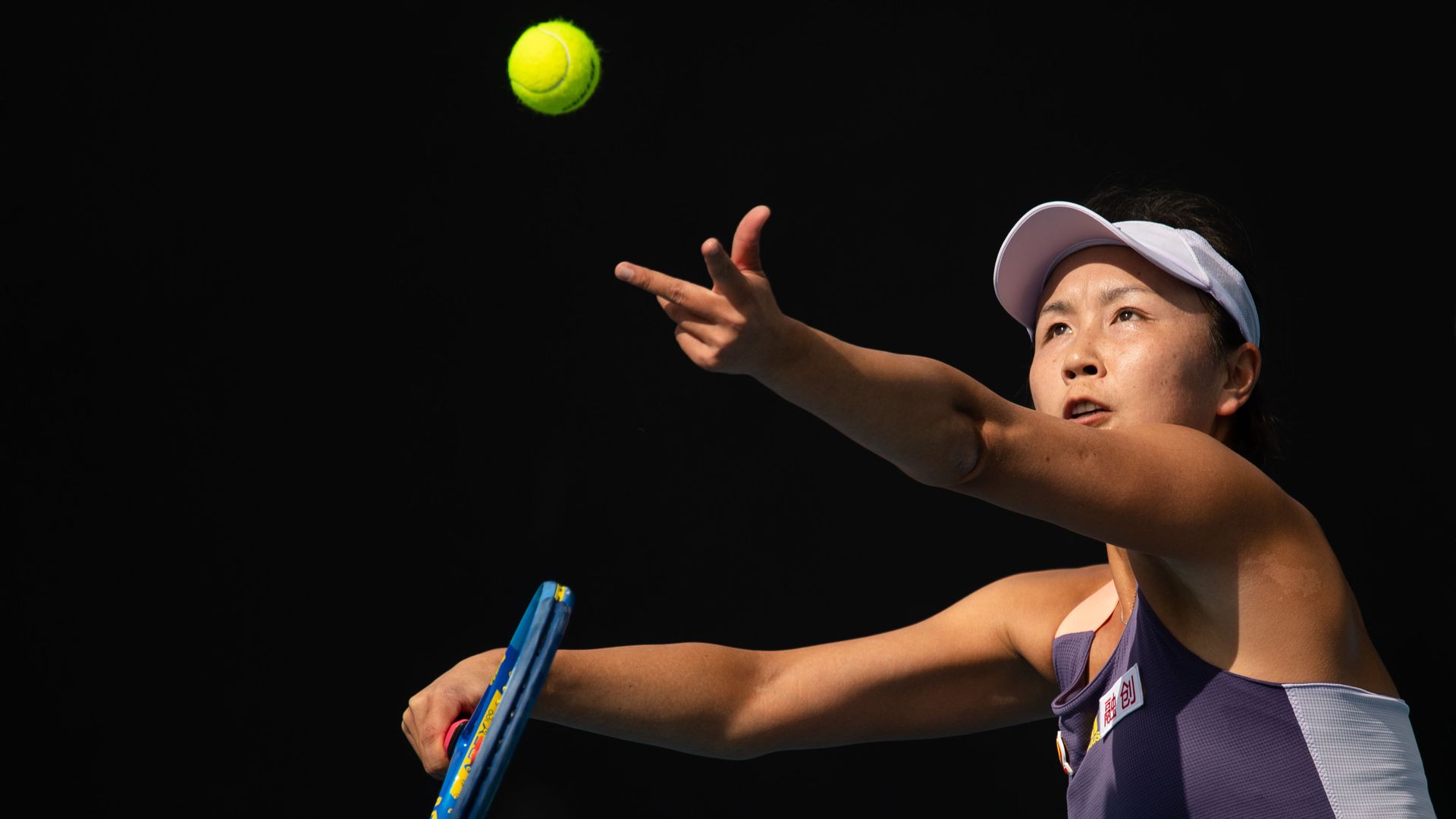 Peng Shuai of China serves to Hibino Nao of Japan during their women's singles first round match at the Australian Open tennis championship in Melbourne, Australia on Jan. 21