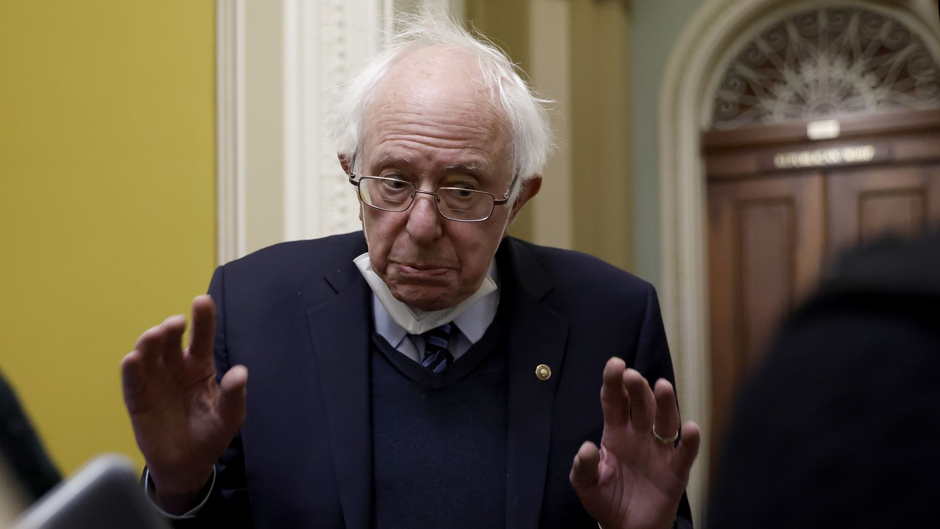 Senator Bernie Sanders talks to reporters at the Capitol