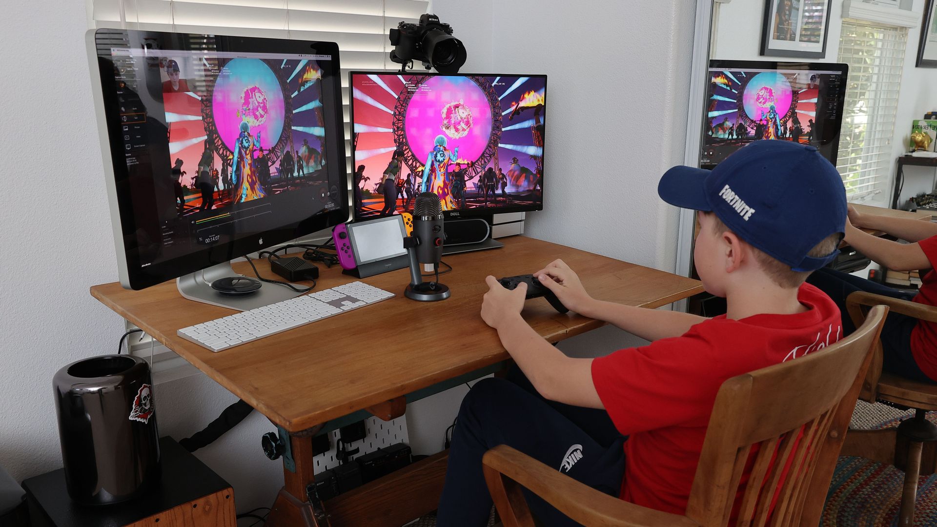 A young gamer is seen playing Fortnite.