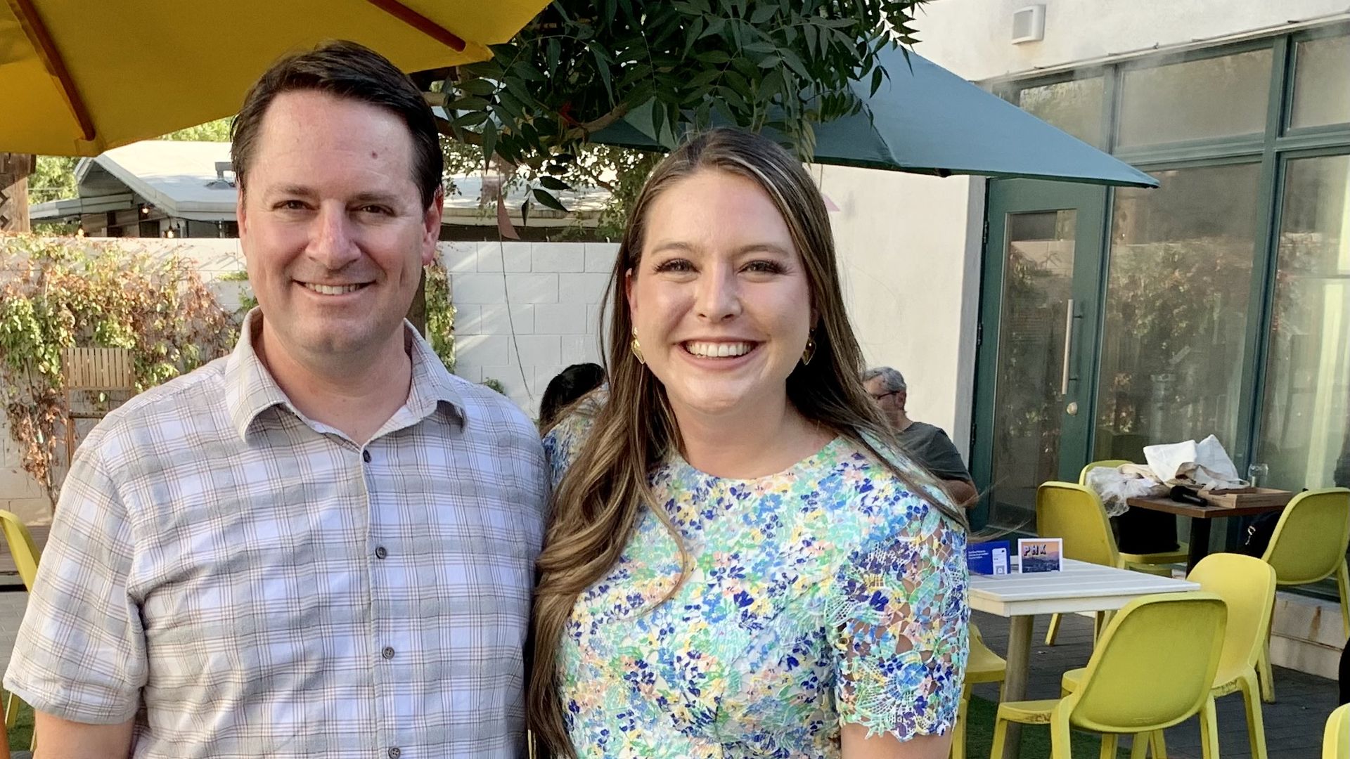 A man and woman smiling. 