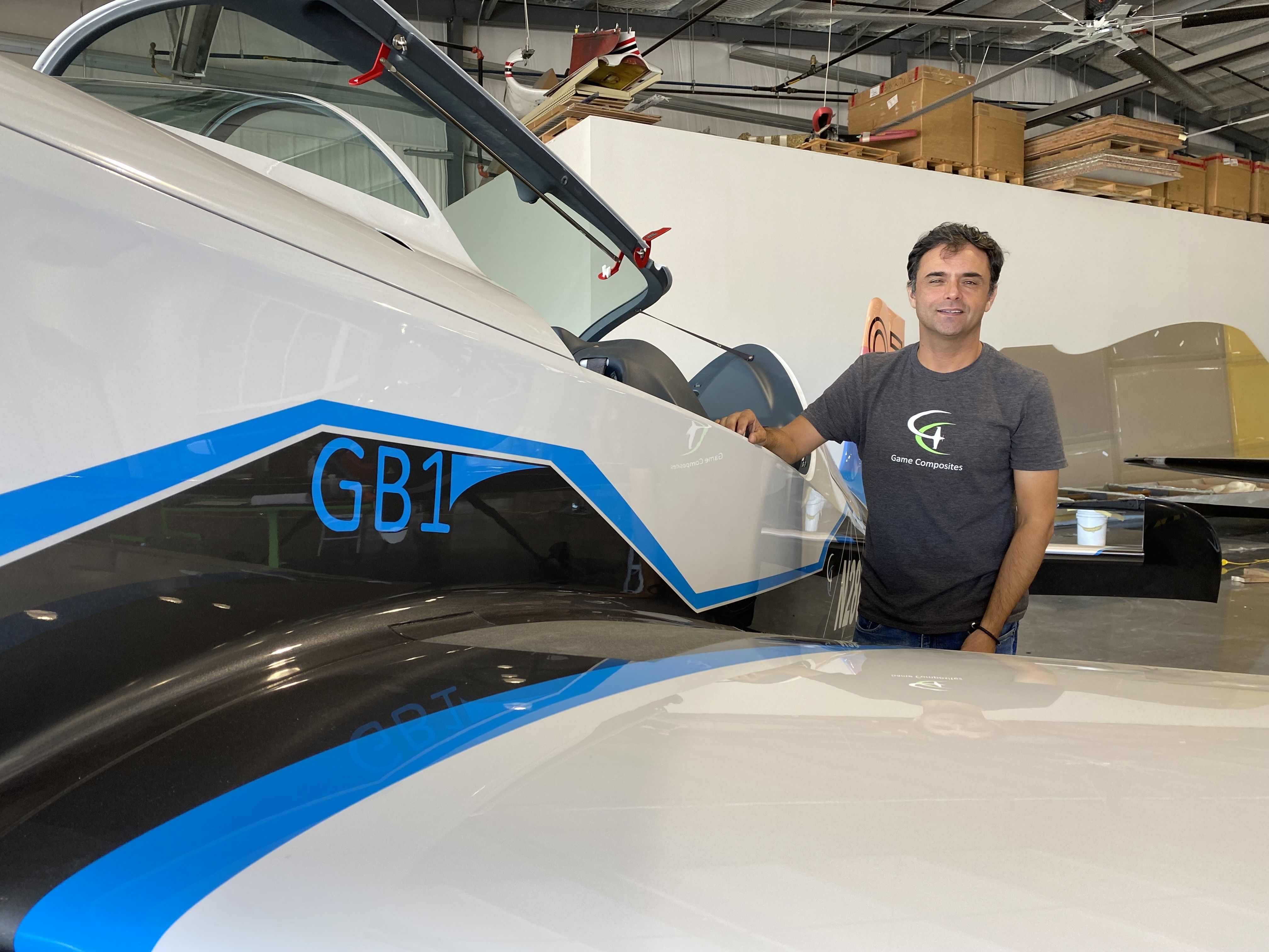 Cristain Bolton, a test pilot, shows of a GameBird 1. 