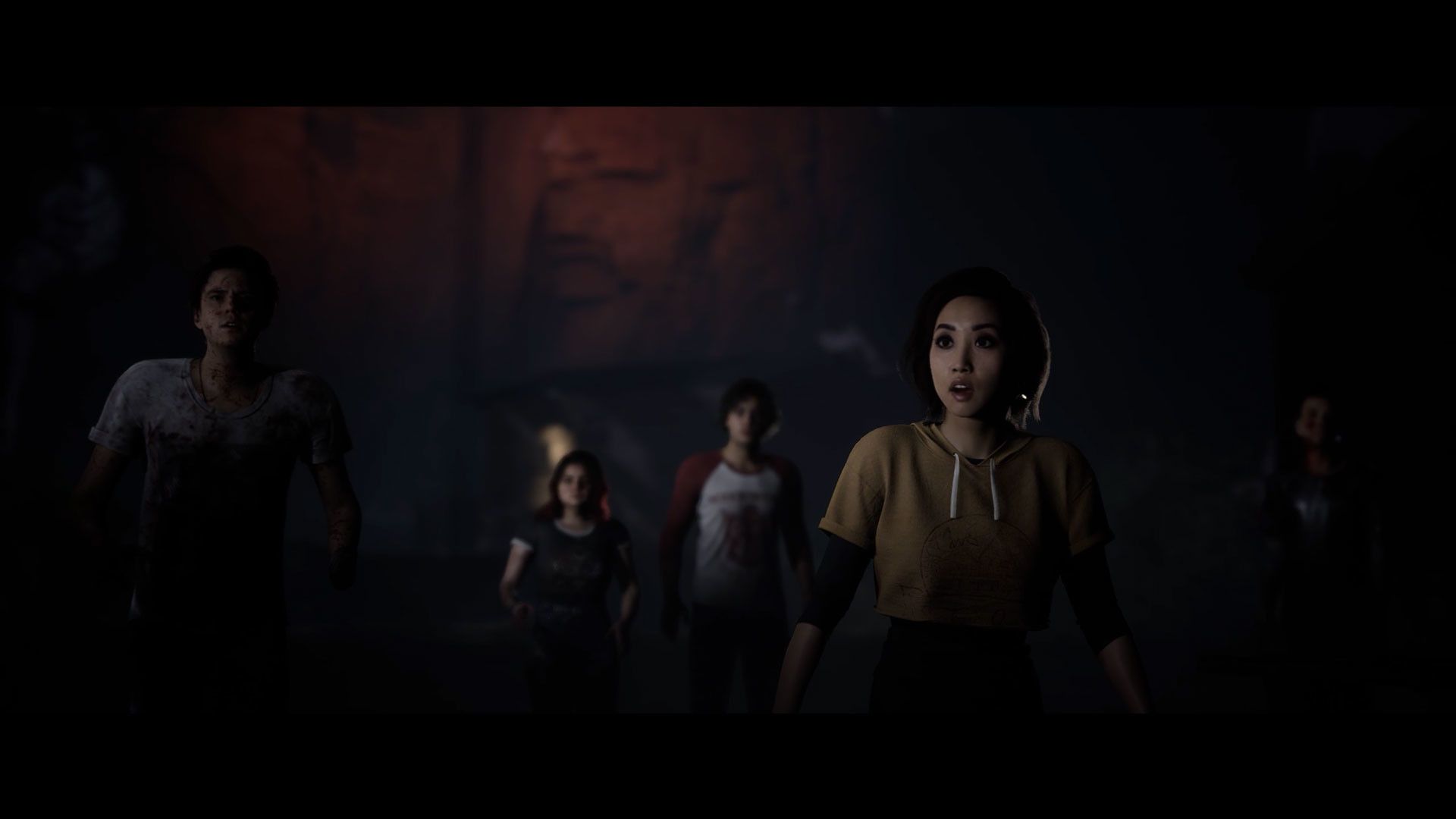 Video game screenshot of a scared group of teenagers