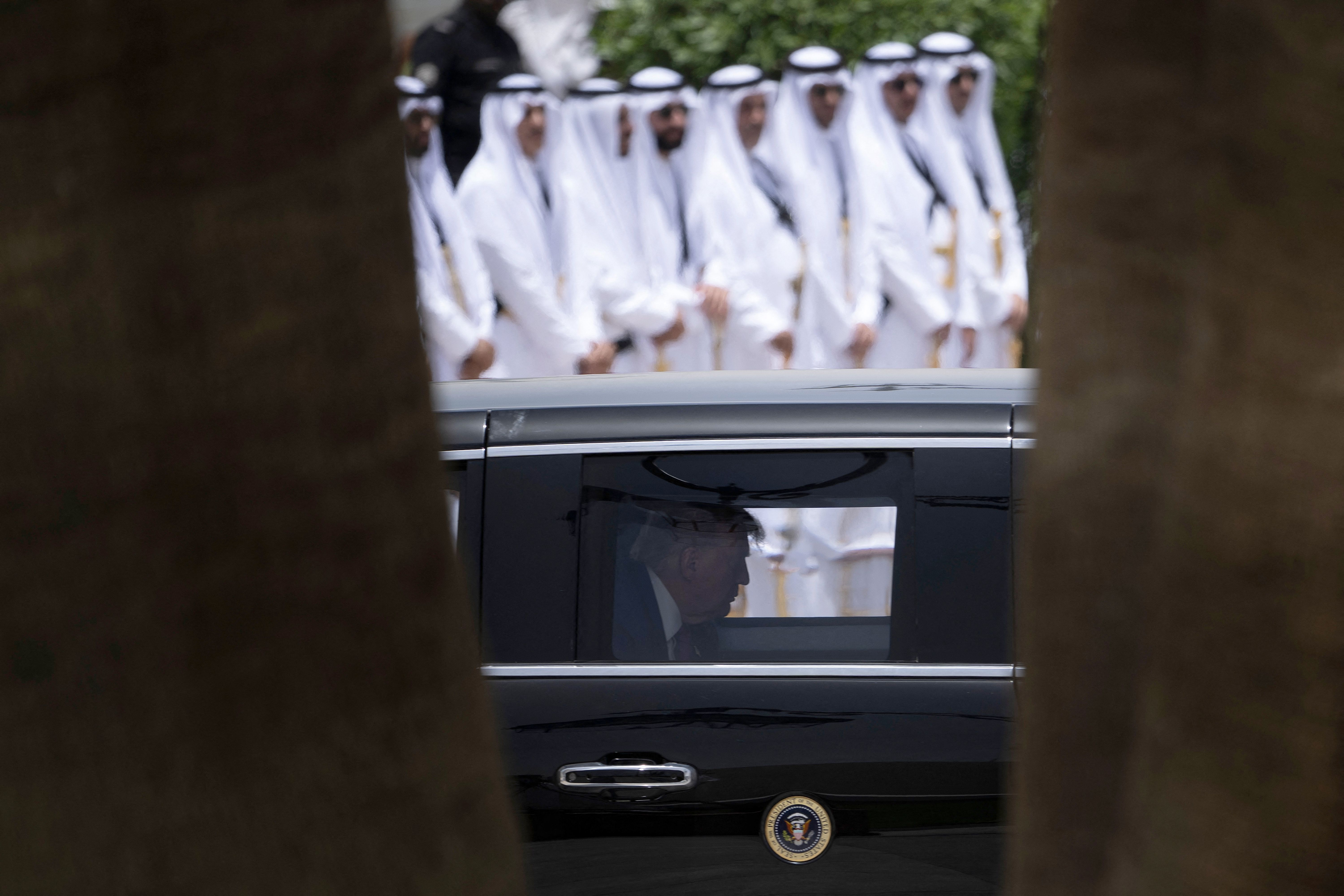 President Trump arrives at the Royal Court in Riyadh, Saudi Arabia, in "The Beast" yesterday.